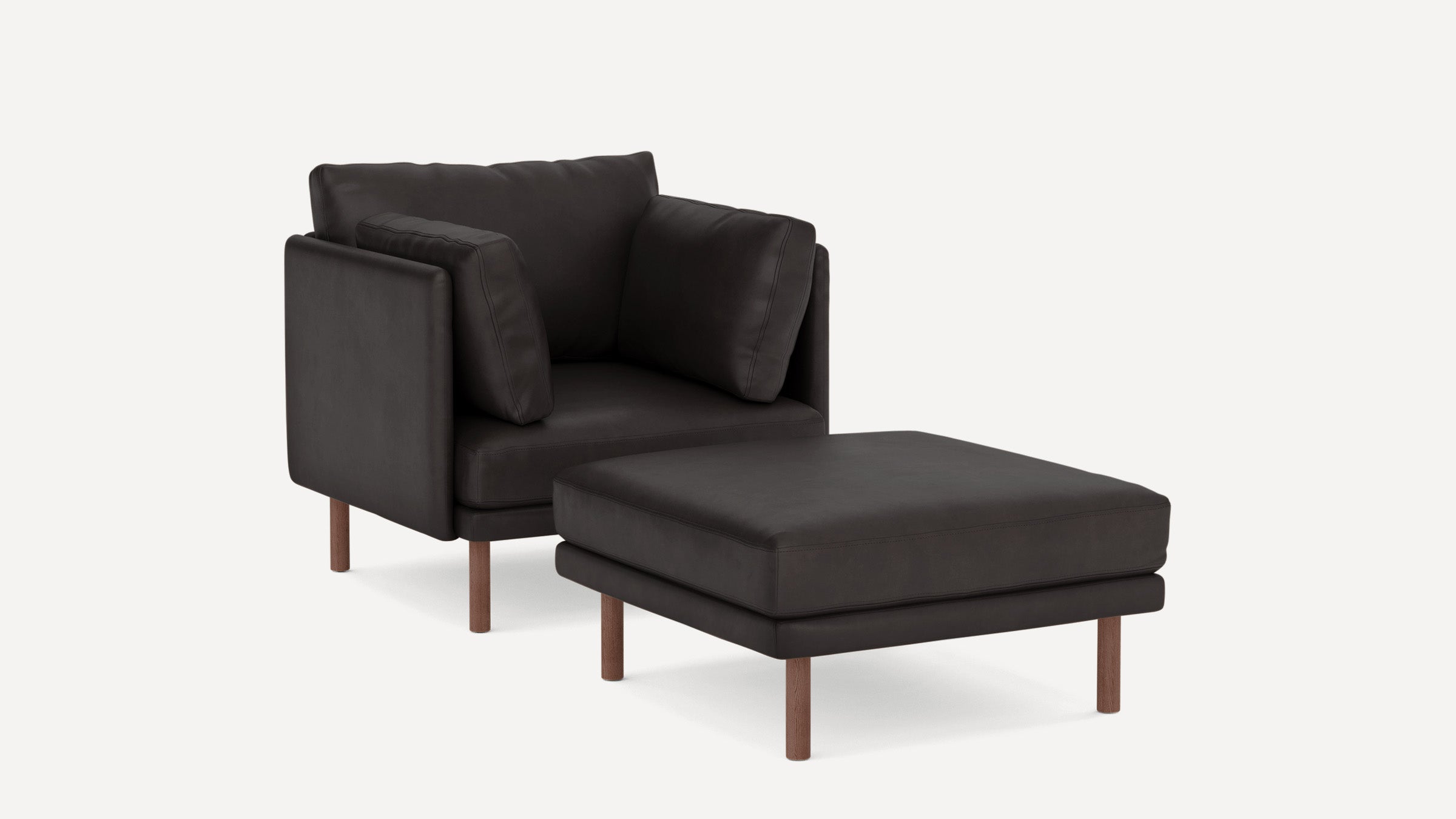 Modern dark brown leather armchair with matching cushioned ottoman, both supported by wooden legs.