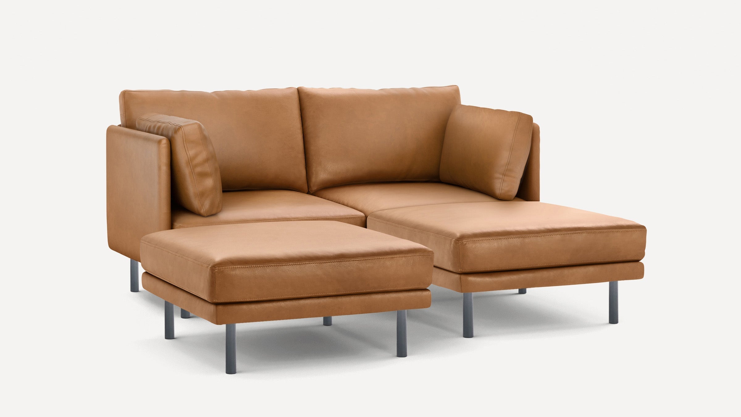 Modern tan leather sectional sofa with metal legs, featuring two seat cushions and three back cushions.
