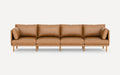 Modern four-seater tan leather sofa with wooden legs and removable cushions, minimalist design on white background.
