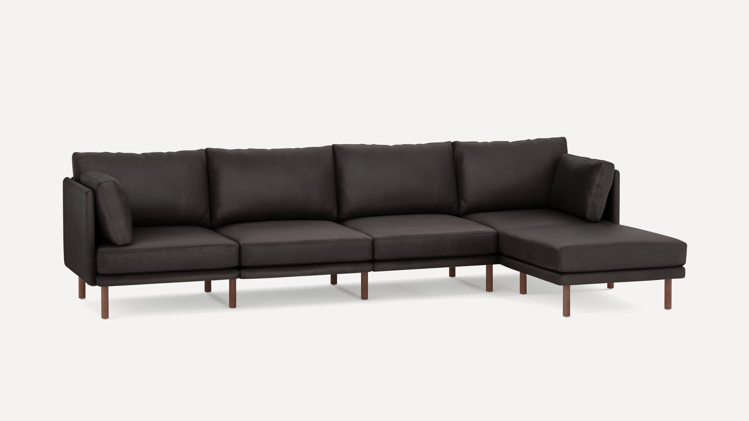 Modern dark gray sectional sofa with clean lines, plush cushions, wooden legs, and chaise lounge on the right side.