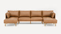 Modern tan leather sectional sofa with wooden legs, featuring left and right chaise lounges and cushioned backrests.