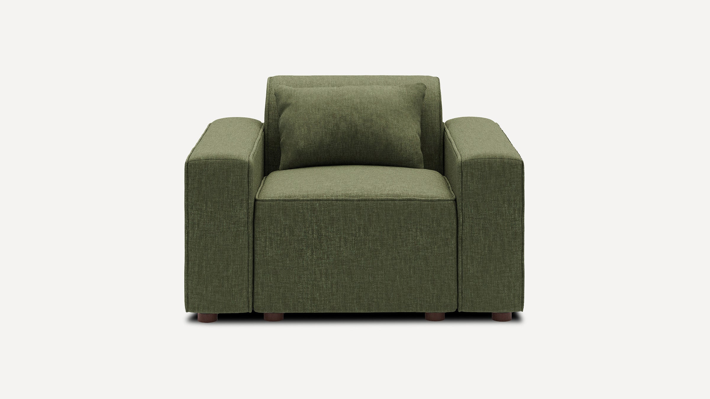 Green upholstered armchair with thick square arms, wide seat cushion, matching back cushion, and short wooden legs.