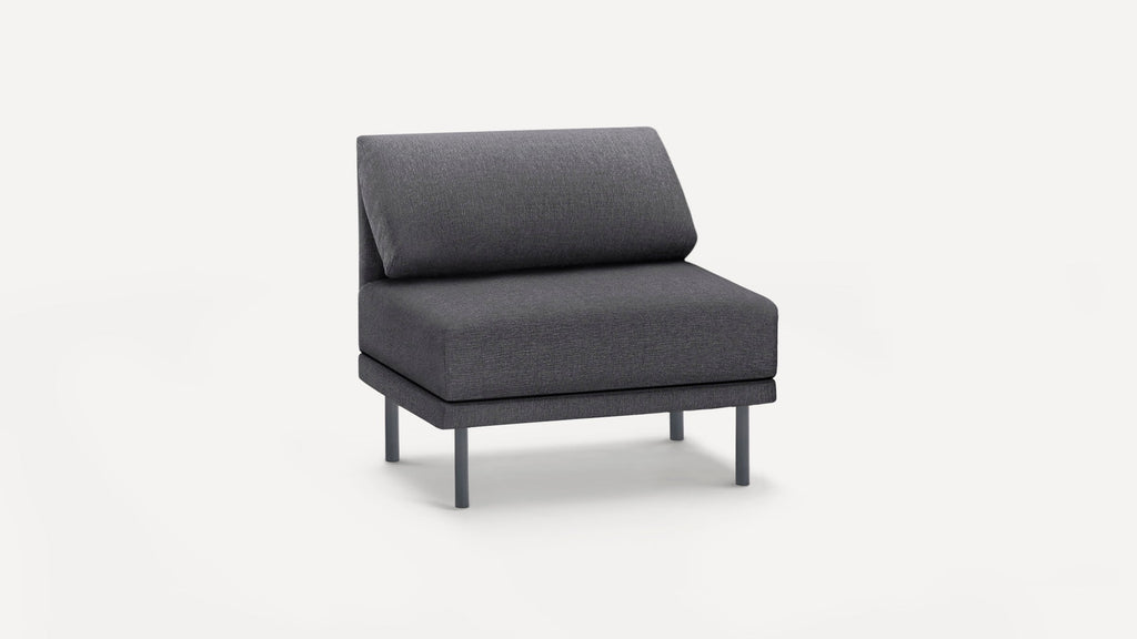 Modern dark gray armless accent chair with padded seat and backrest, supported by four slim metal legs.