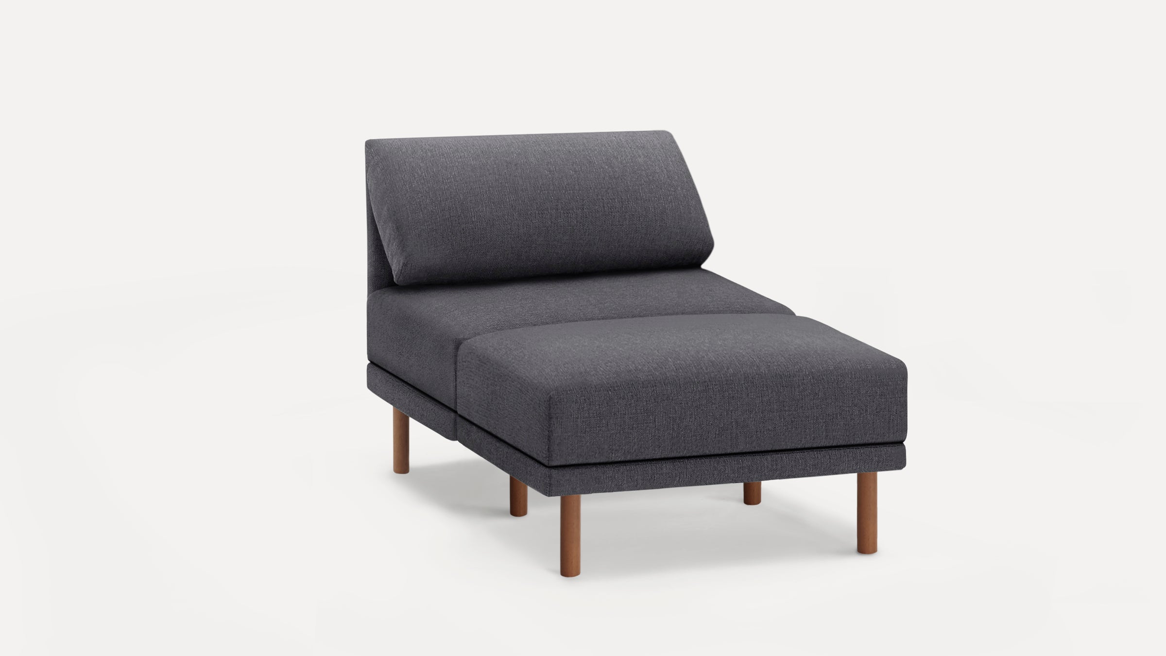 Grey upholstered lounge chair with wooden legs and cushioned backrest, modern minimalist design on white background.