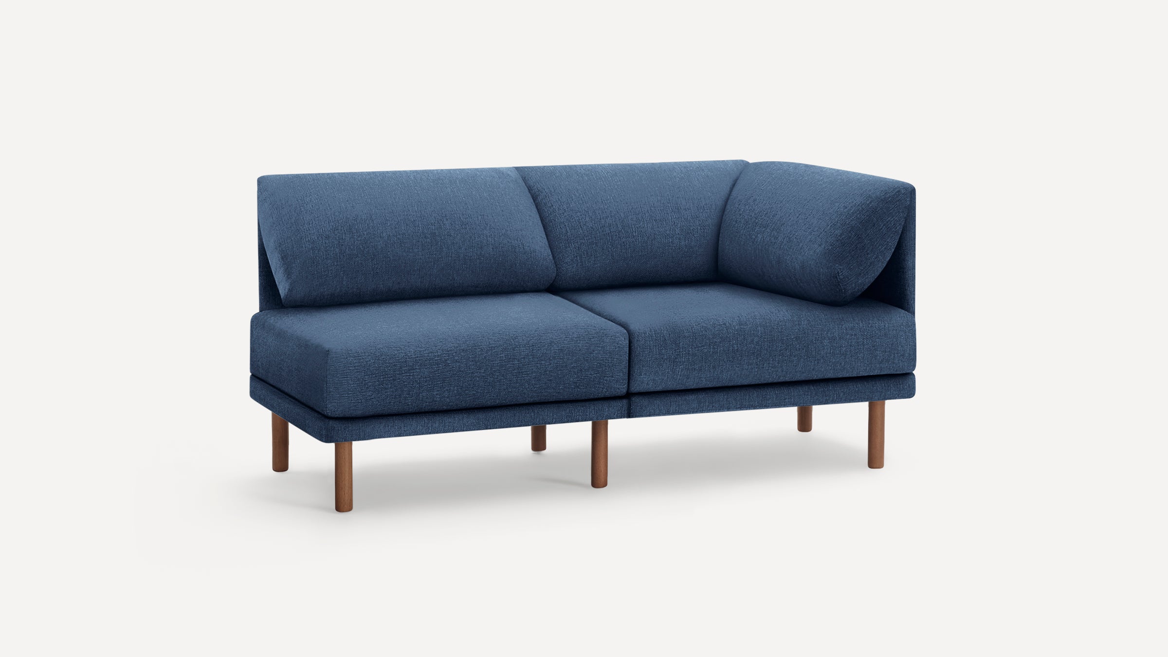Modern blue fabric two-seater sofa with angled back cushions and wooden legs, set against a plain white background.