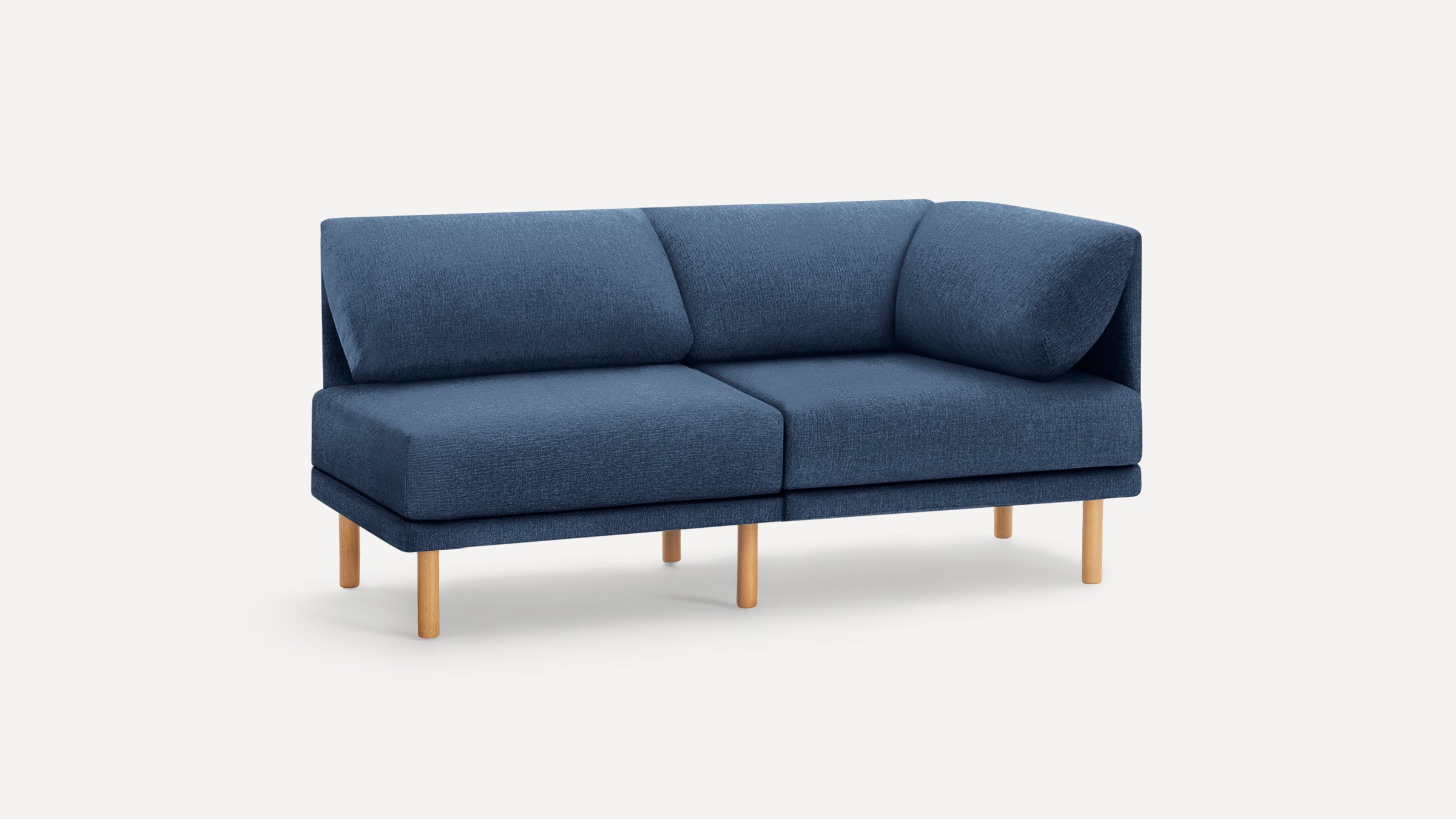 Modern navy blue fabric loveseat sofa with wooden legs, featuring a corner backrest and plush cushions.