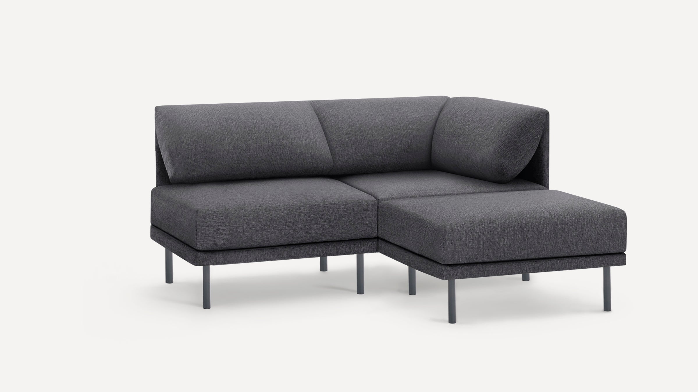 Modern dark gray modular corner sofa with metal legs and cushioned backrest on a white background.