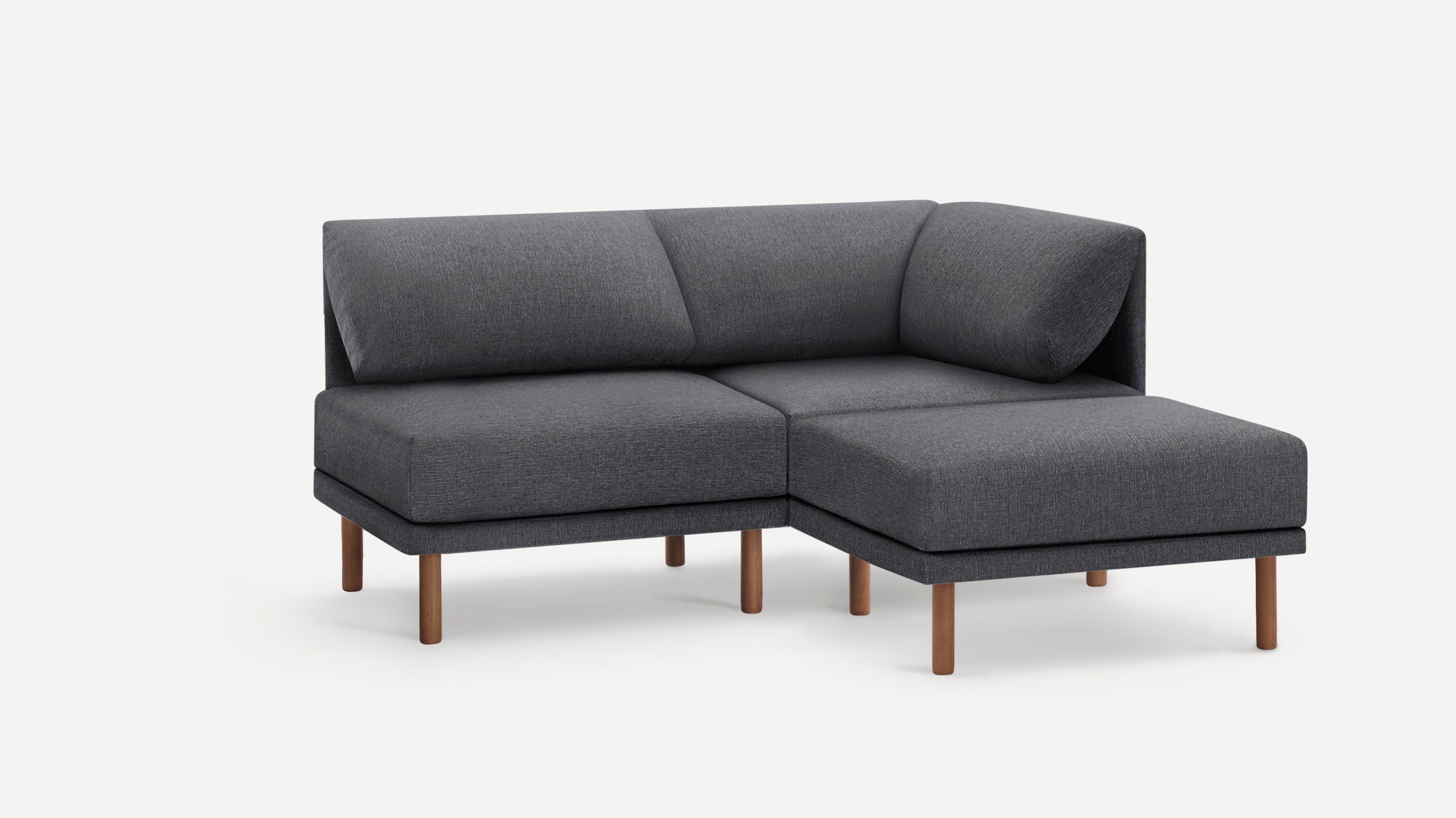 Modern dark gray sectional sofa with wooden legs, featuring a corner design and plush cushions for comfortable seating.