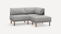Modern L-shaped gray fabric sectional sofa with wooden legs, featuring a corner backrest and plush cushions.