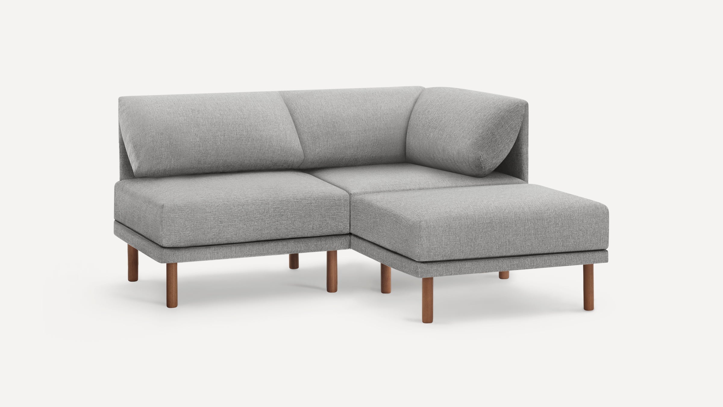 Modern L-shaped gray fabric sectional sofa with wooden legs, featuring a corner backrest and plush cushions.
