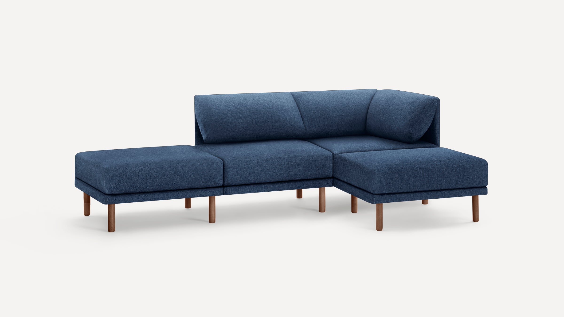 Modern sectional sofa with deep blue fabric upholstery and wooden legs, featuring a right-side chaise lounge.