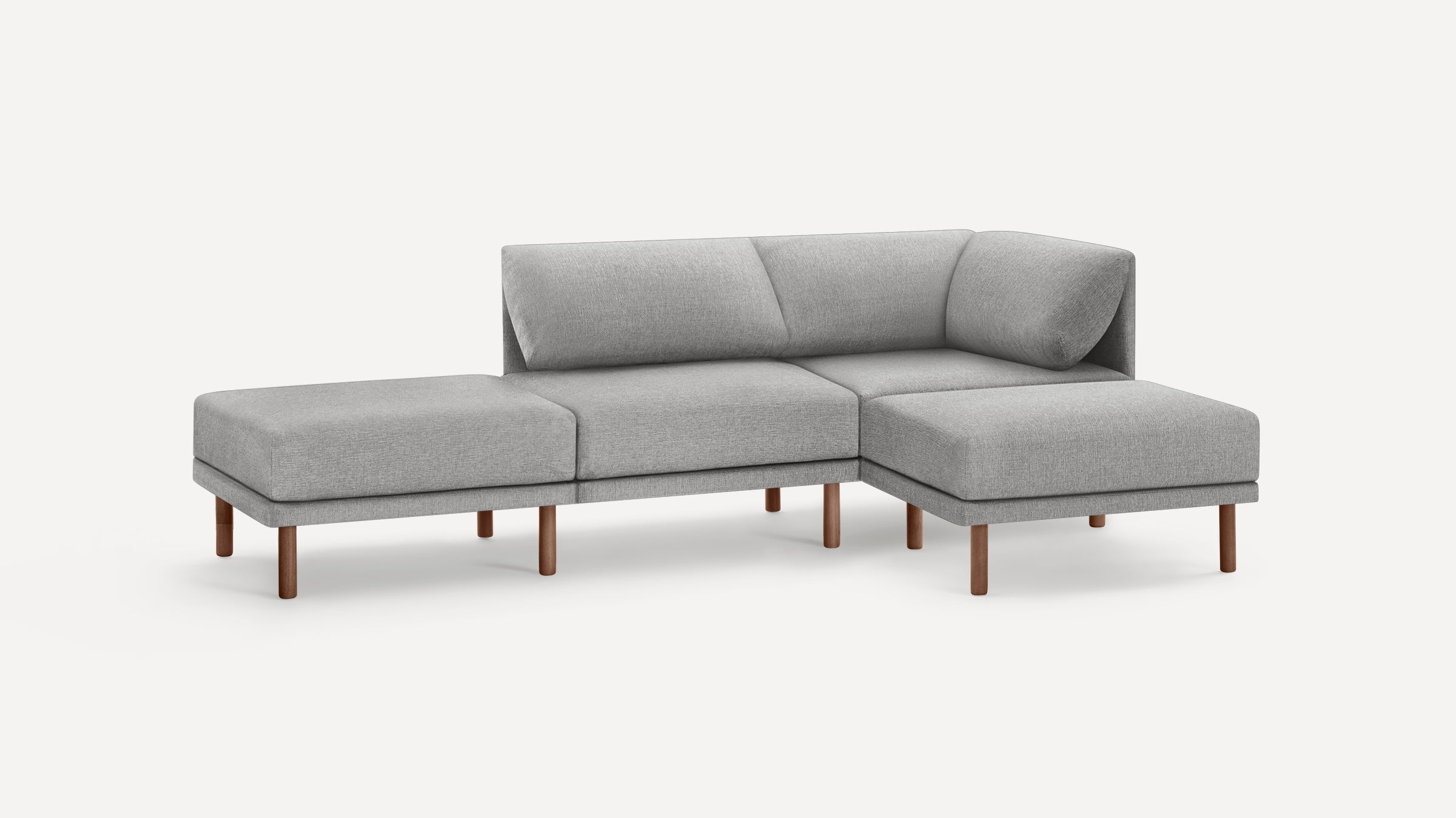 Modern light gray fabric sectional sofa with wooden legs, featuring a right-side chaise lounge and low back cushions.