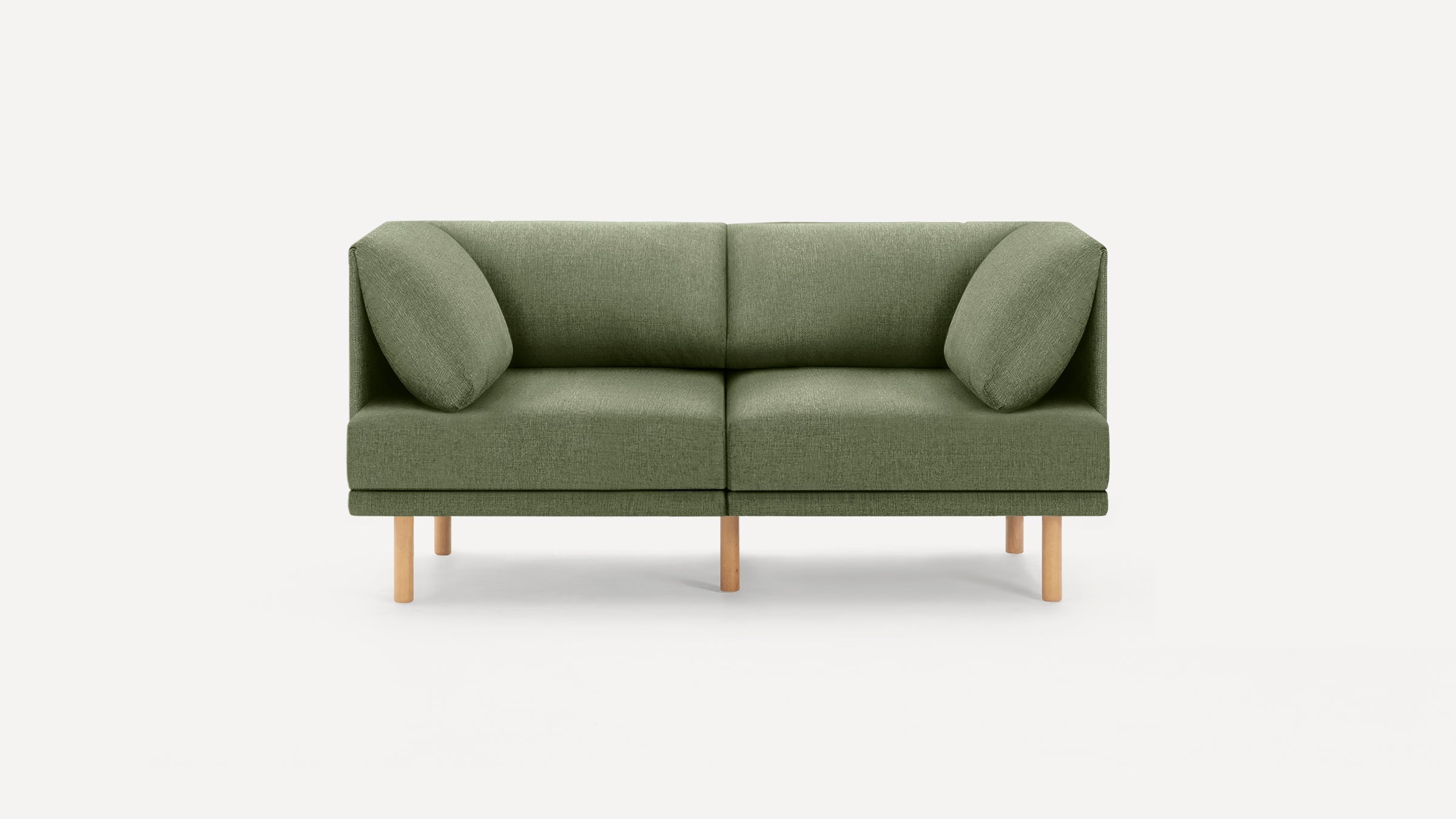 Modern olive green two-seater sofa with wooden legs and two matching angled back cushions on a white background.
