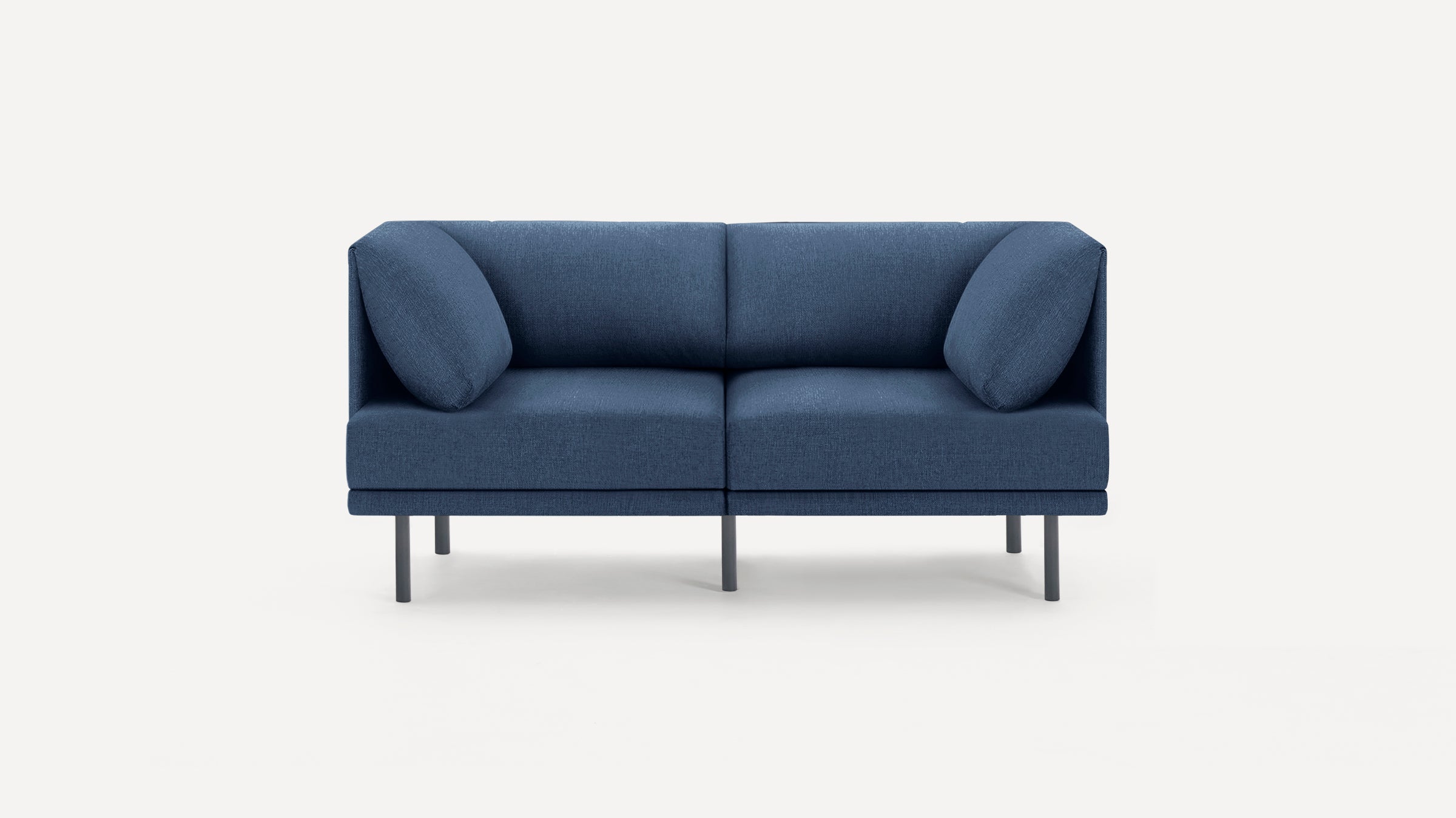Modern blue two-seater sofa with clean lines, metal legs, and two matching side cushions on a white background.