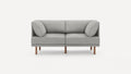 Modern gray fabric two-seater sofa with angled back cushions and wooden legs, set against a white background.