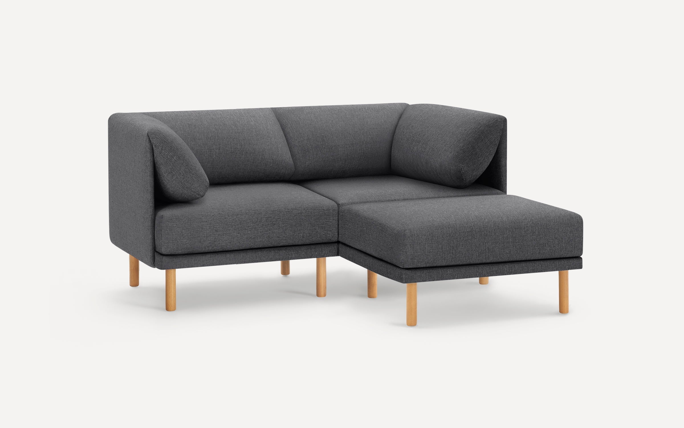 Modern dark gray fabric sectional sofa with wooden legs, L-shaped design, and cushioned backrest and armrests.