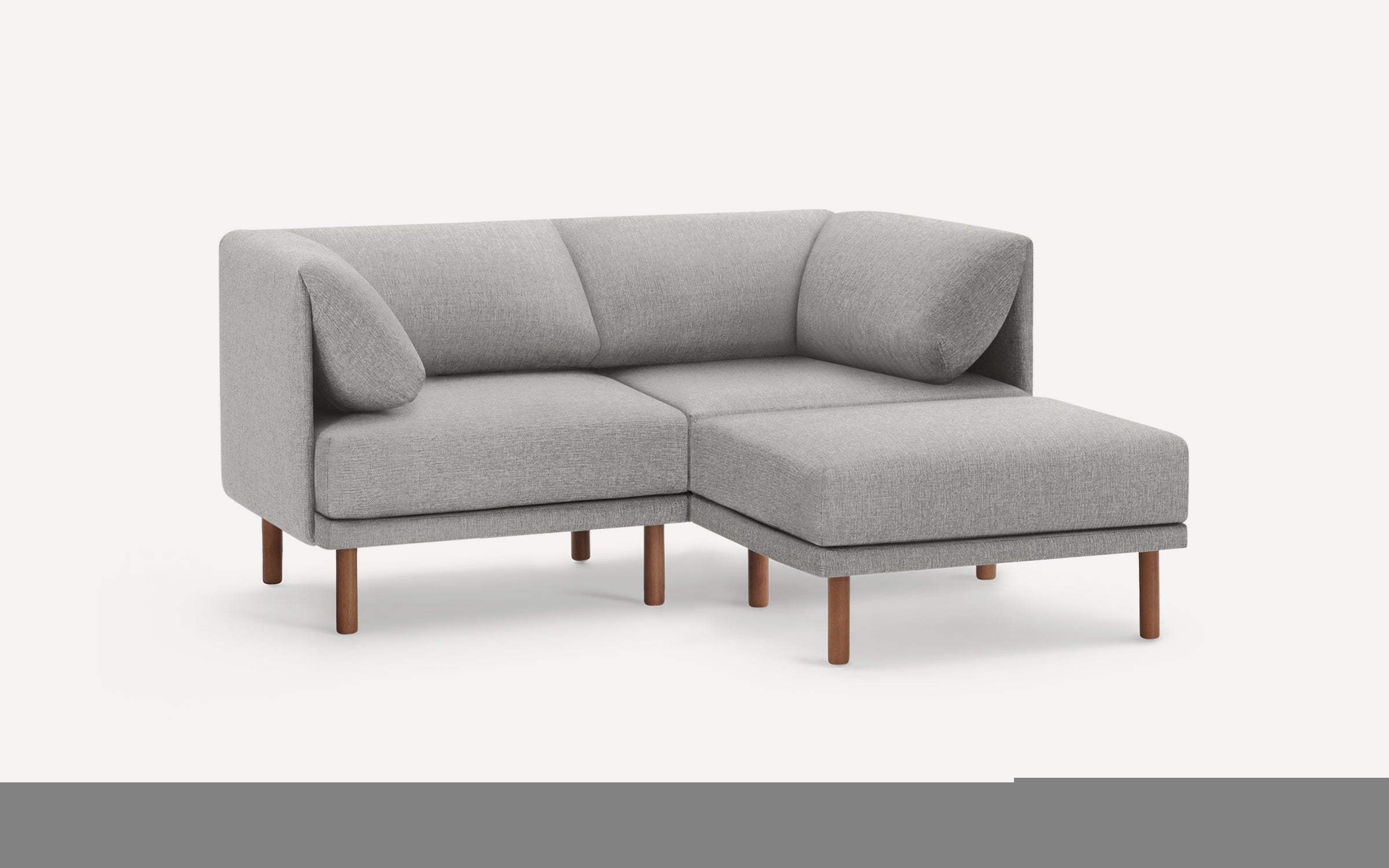 Modern light gray fabric sectional sofa with wooden legs, featuring a right-side chaise and cushioned armrests.