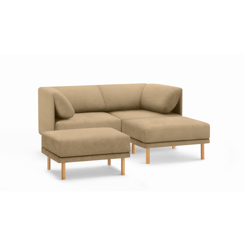 Beige modern sectional sofa with clean lines, wooden legs, cushioned back, and matching ottoman on a black background.