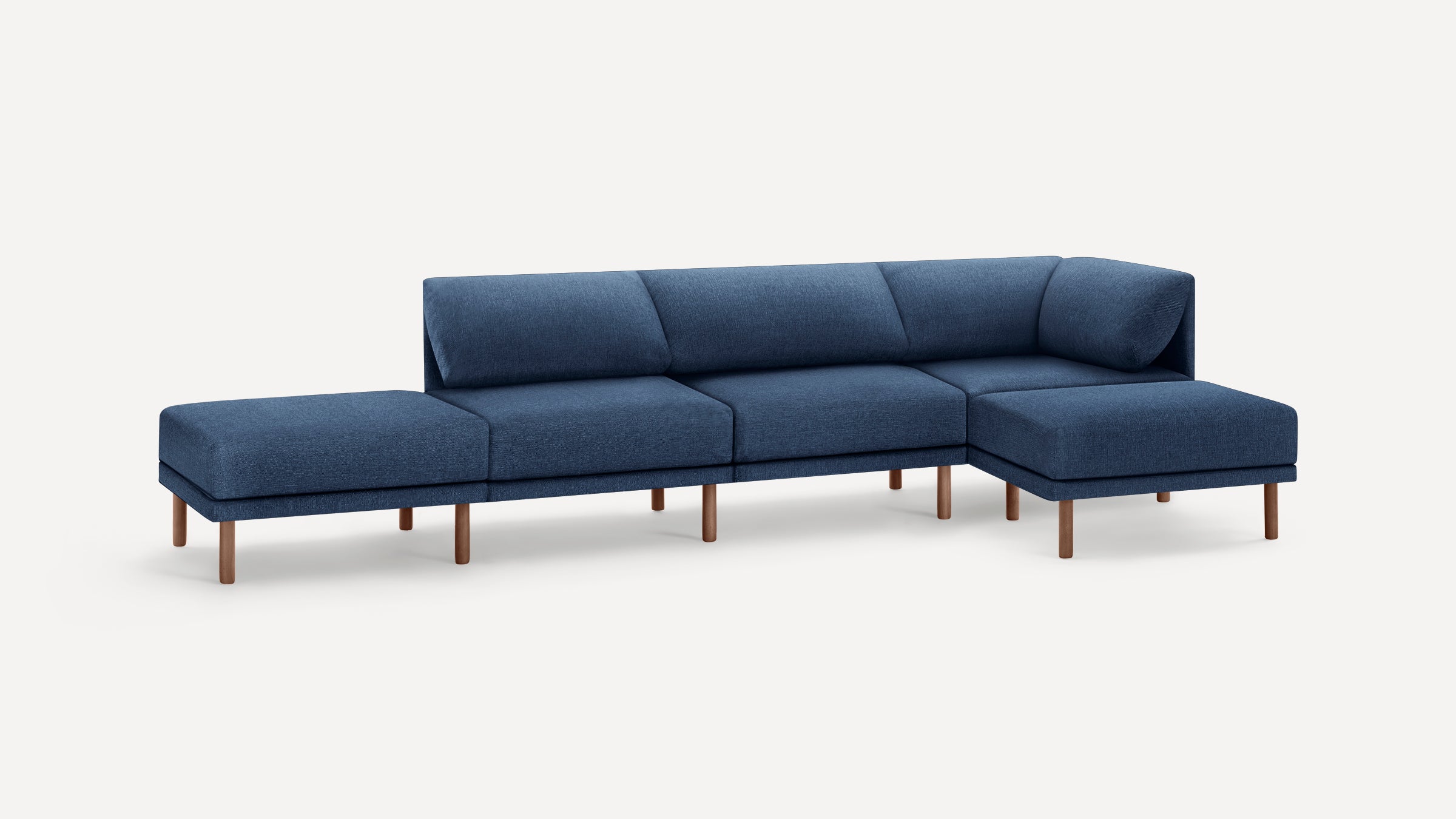 Modern modular sectional sofa with blue fabric upholstery and wooden legs, featuring clean lines and plush cushions.