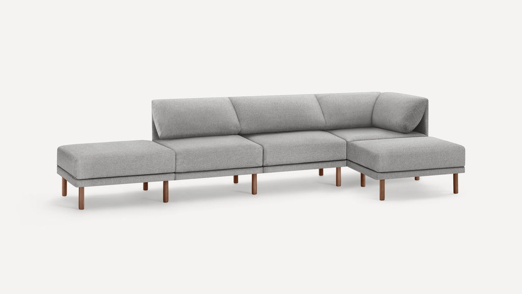Modern gray fabric sectional sofa with wooden legs, featuring clean lines and plush cushions for comfortable seating.
