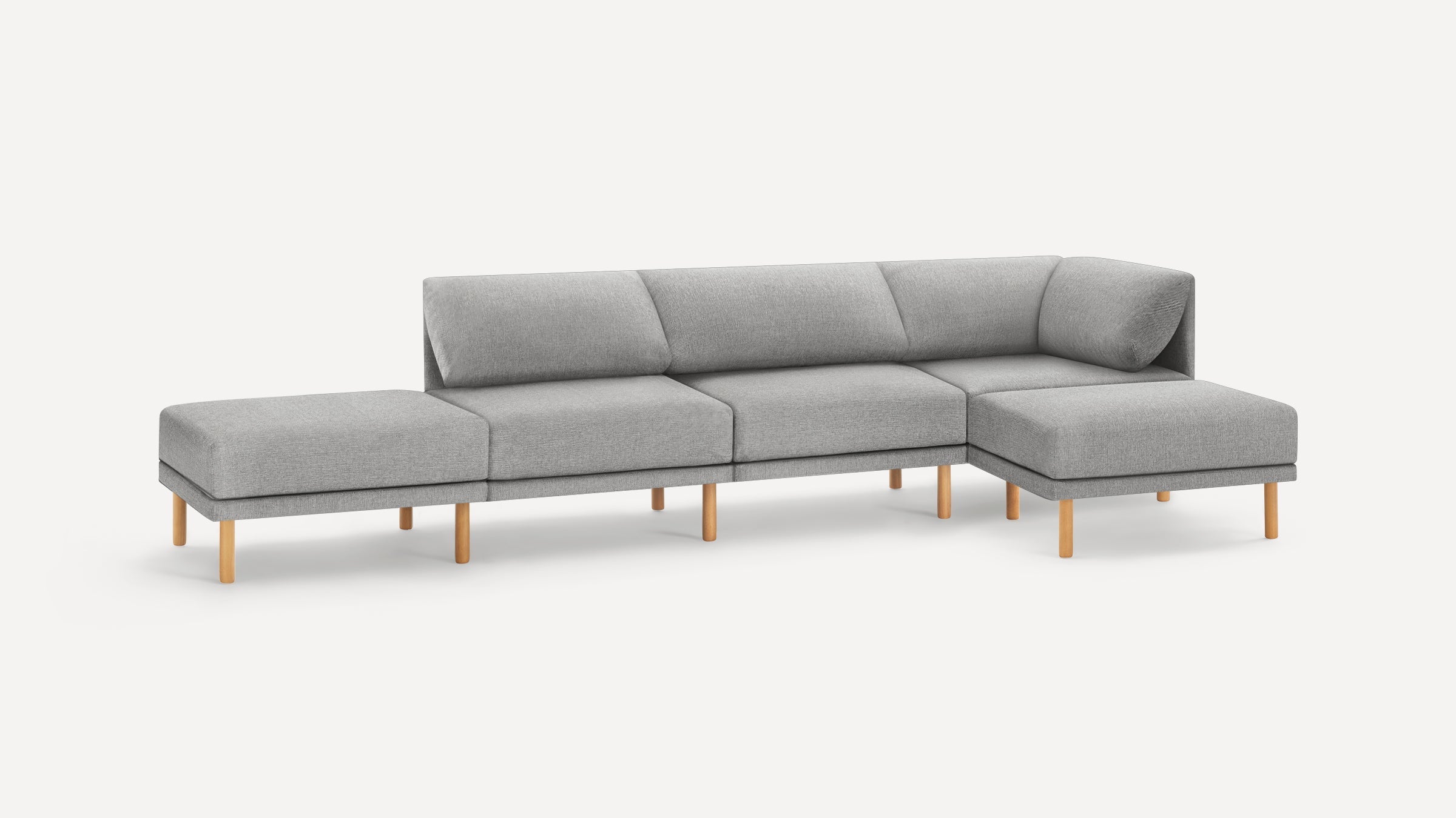 Modern light gray fabric sectional sofa with wooden legs, featuring a chaise lounge on right side and minimalist design.