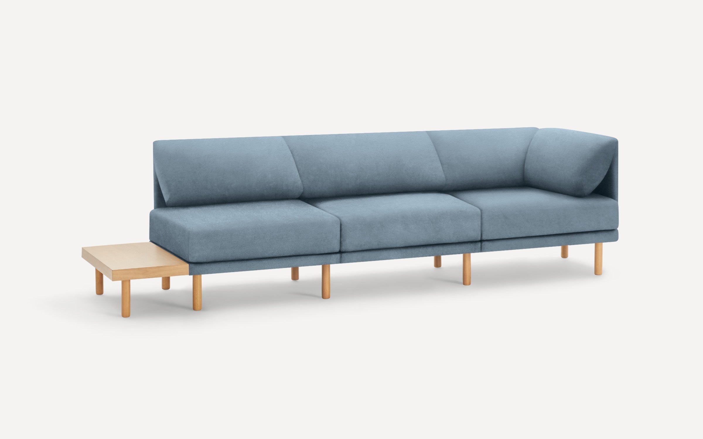 modern light blue fabric sectional sofa with wooden legs and clean lines on the back, featuring a clean, minimalist design