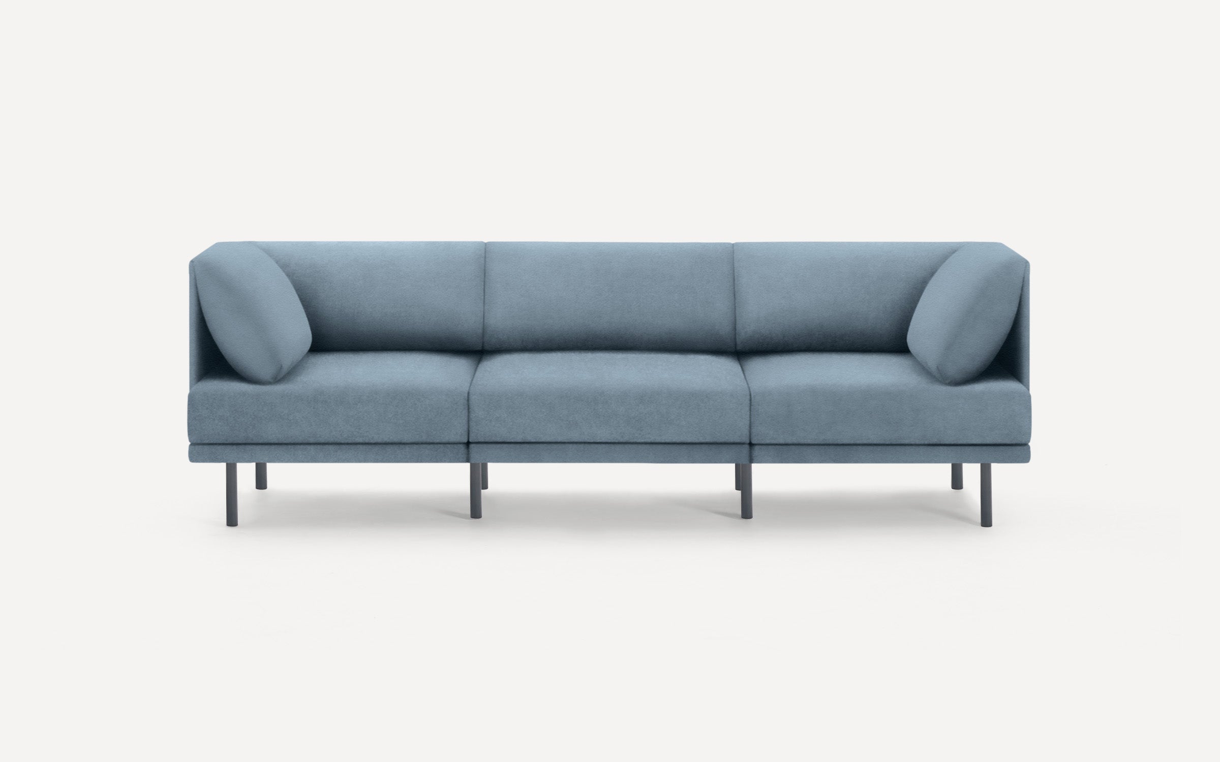 modern blue fabric sofa with black metal legs and clean lines on a white background
