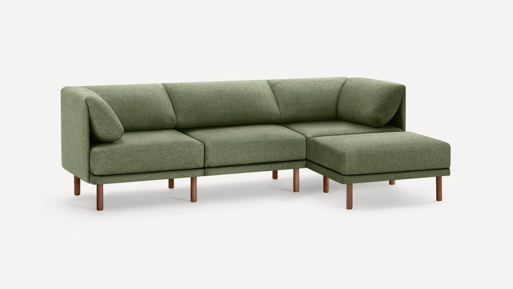 Modern sectional sofa with green fabric upholstery, wooden legs, and cushioned backrest and armrests on both ends.