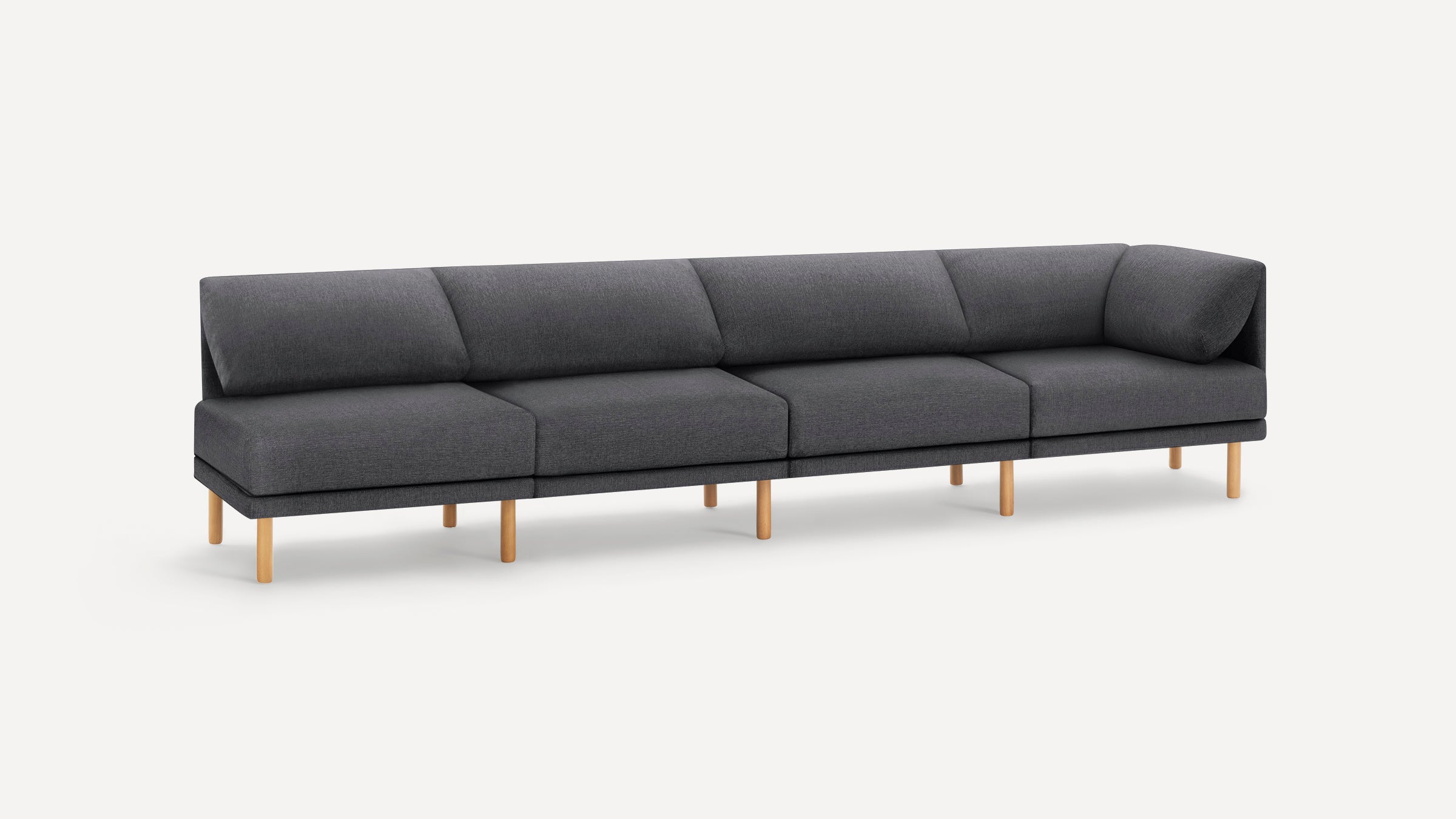 Modern dark gray fabric sectional sofa with light wooden legs and clean, angular lines against a white background.