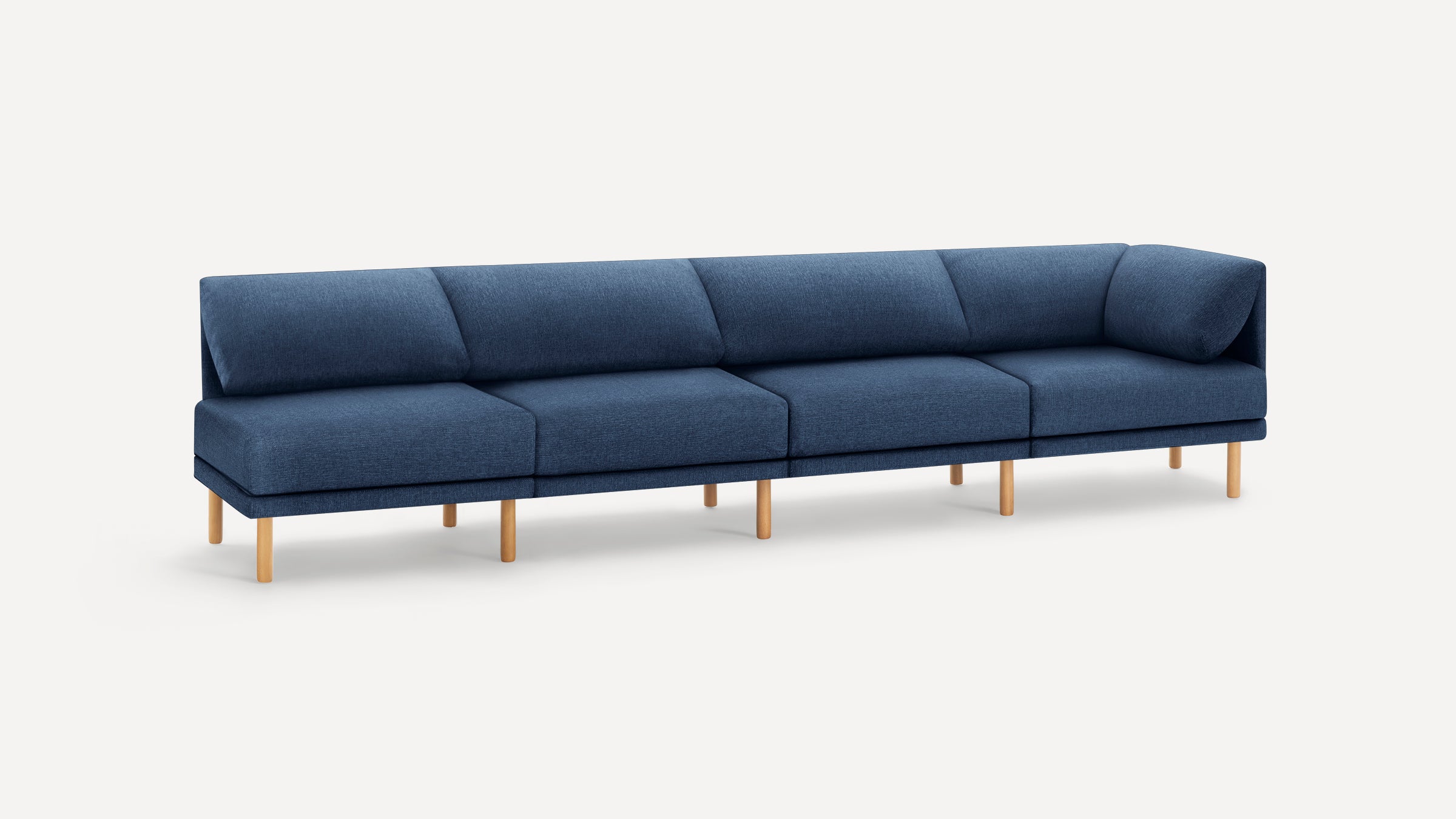 Modern L-shaped sectional sofa with deep blue fabric upholstery and light wooden legs, designed for spacious seating.