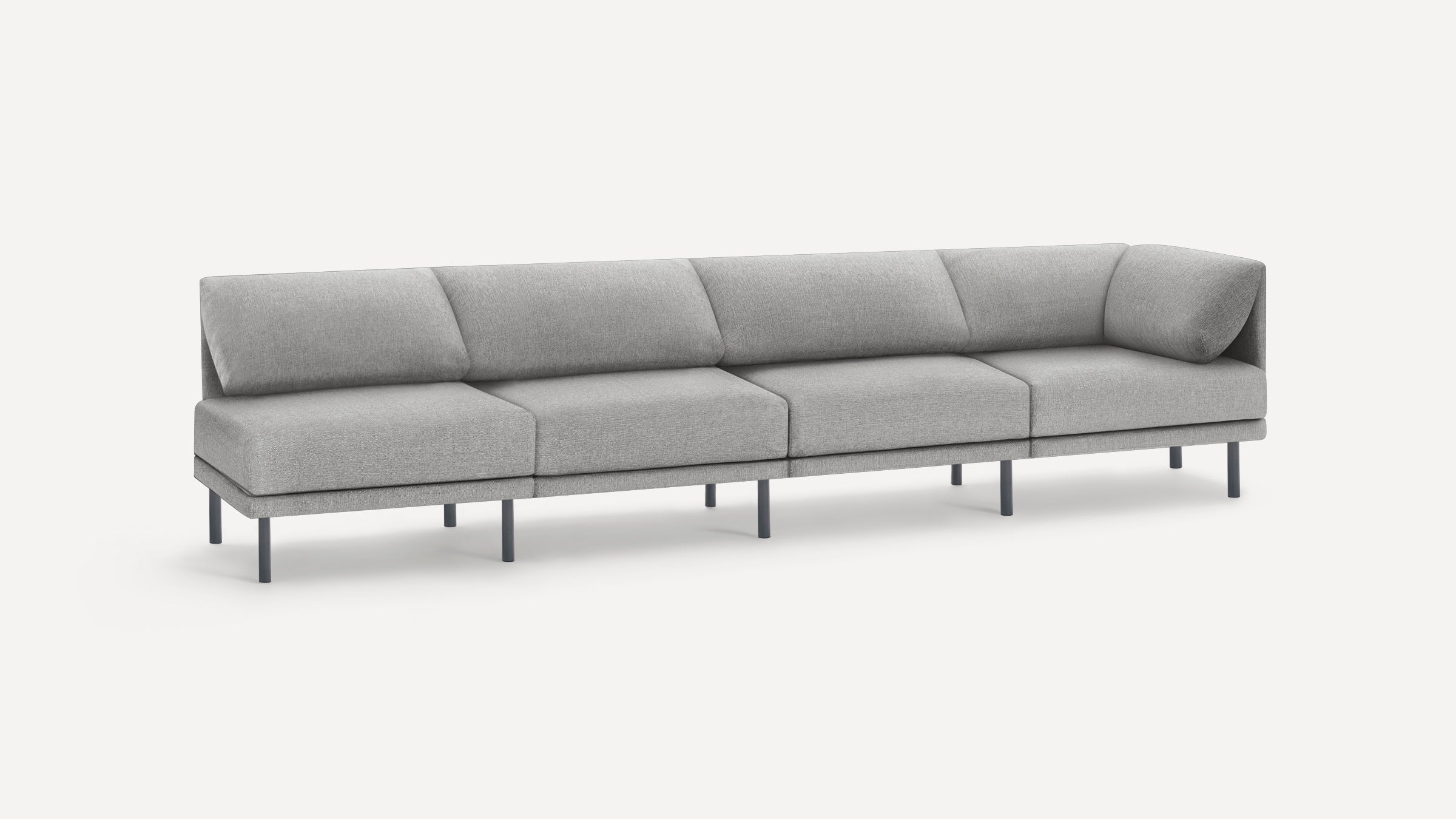 Modern, minimalist light gray sectional sofa with five cushioned seats and dark slender legs on a white background.