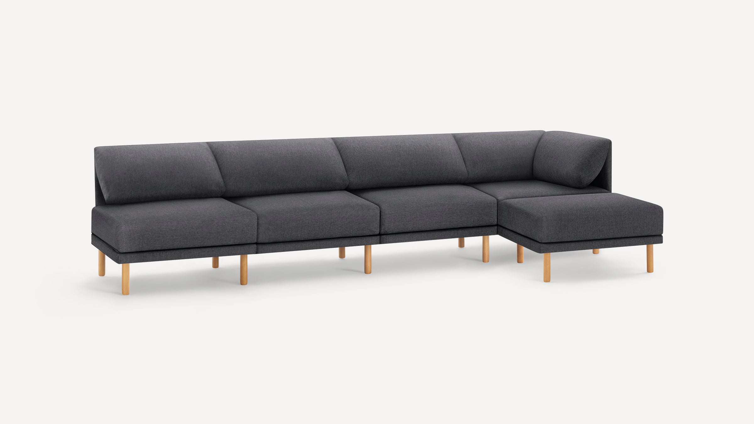 Modern L-shaped dark gray fabric sectional sofa with wooden legs and cushioned backrest on a white background.