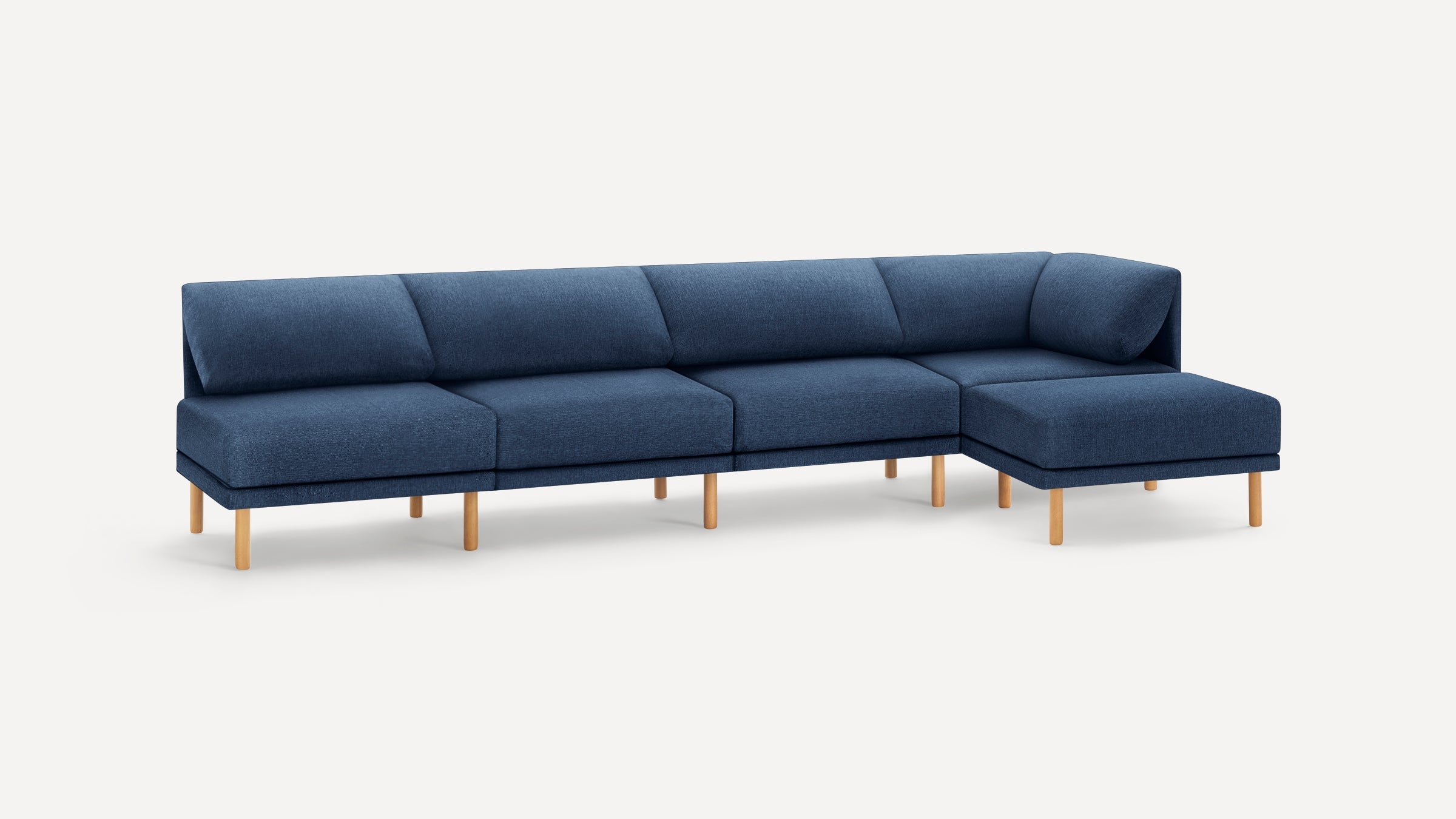 L-shaped modern navy blue fabric sofa with wooden legs, featuring cushioned seats and backrests on a white background.