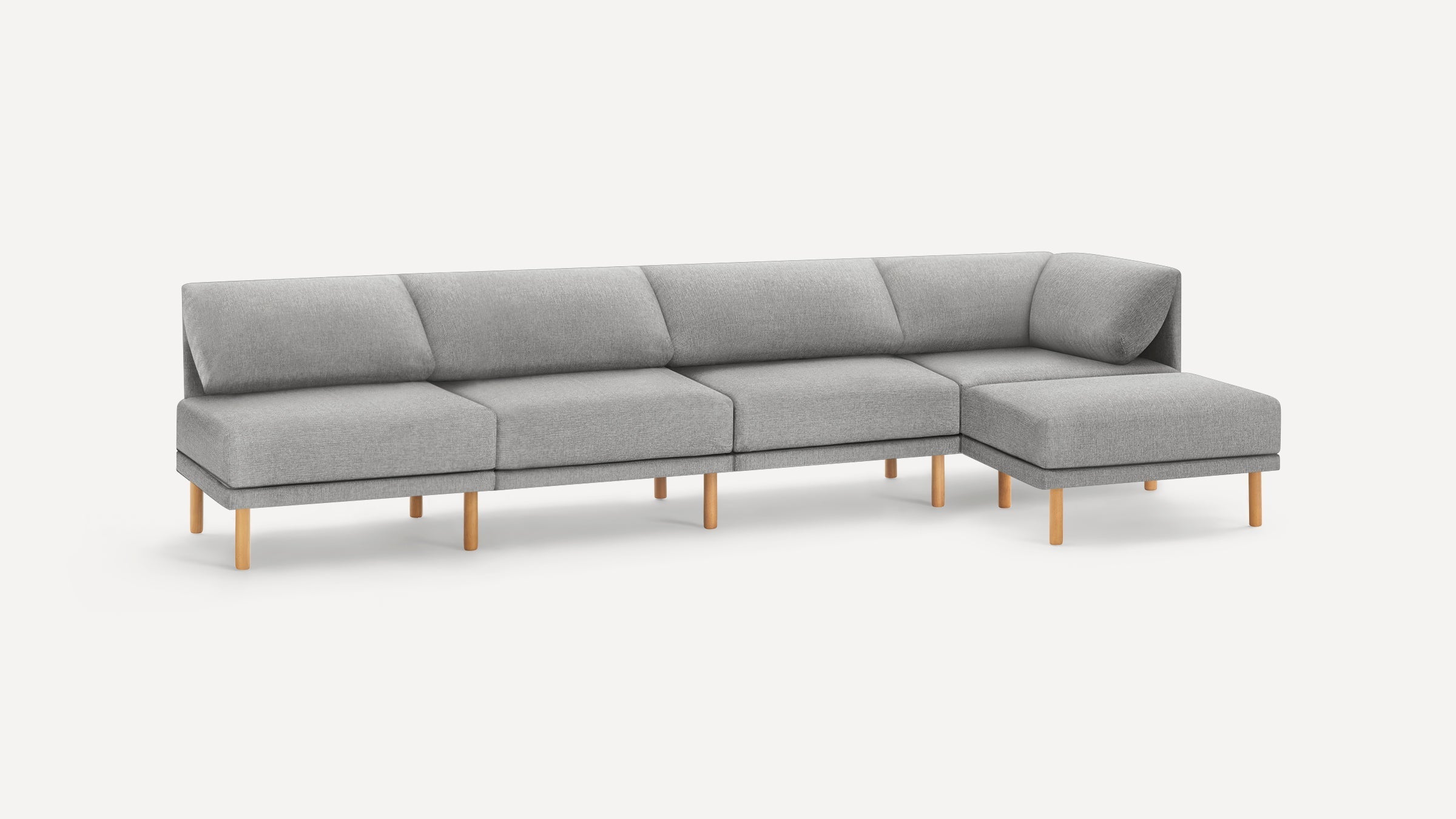 Modern gray fabric sectional sofa with wooden legs, featuring four cushioned seats and a right-side chaise lounge.
