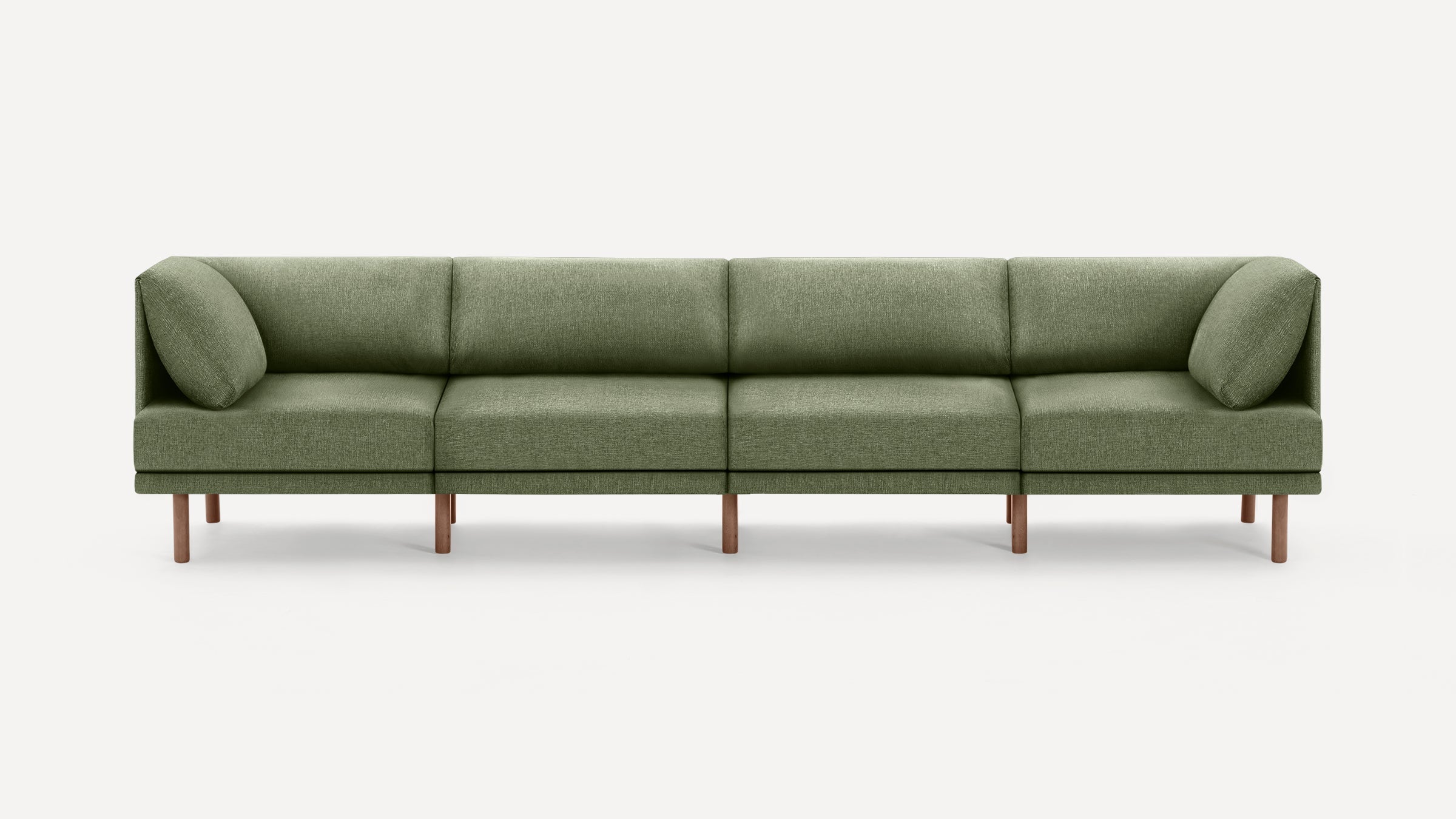 Four-seater modern olive green fabric sofa with clean lines and wooden legs, featuring two angled side cushions.