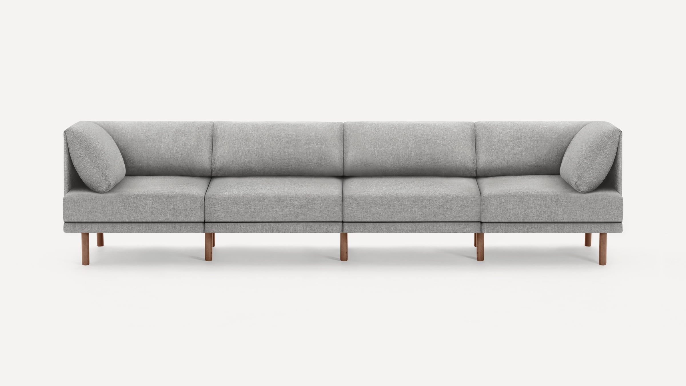 Modern minimalist gray fabric sofa with wooden legs, featuring clean lines and two end cushions for added comfort.