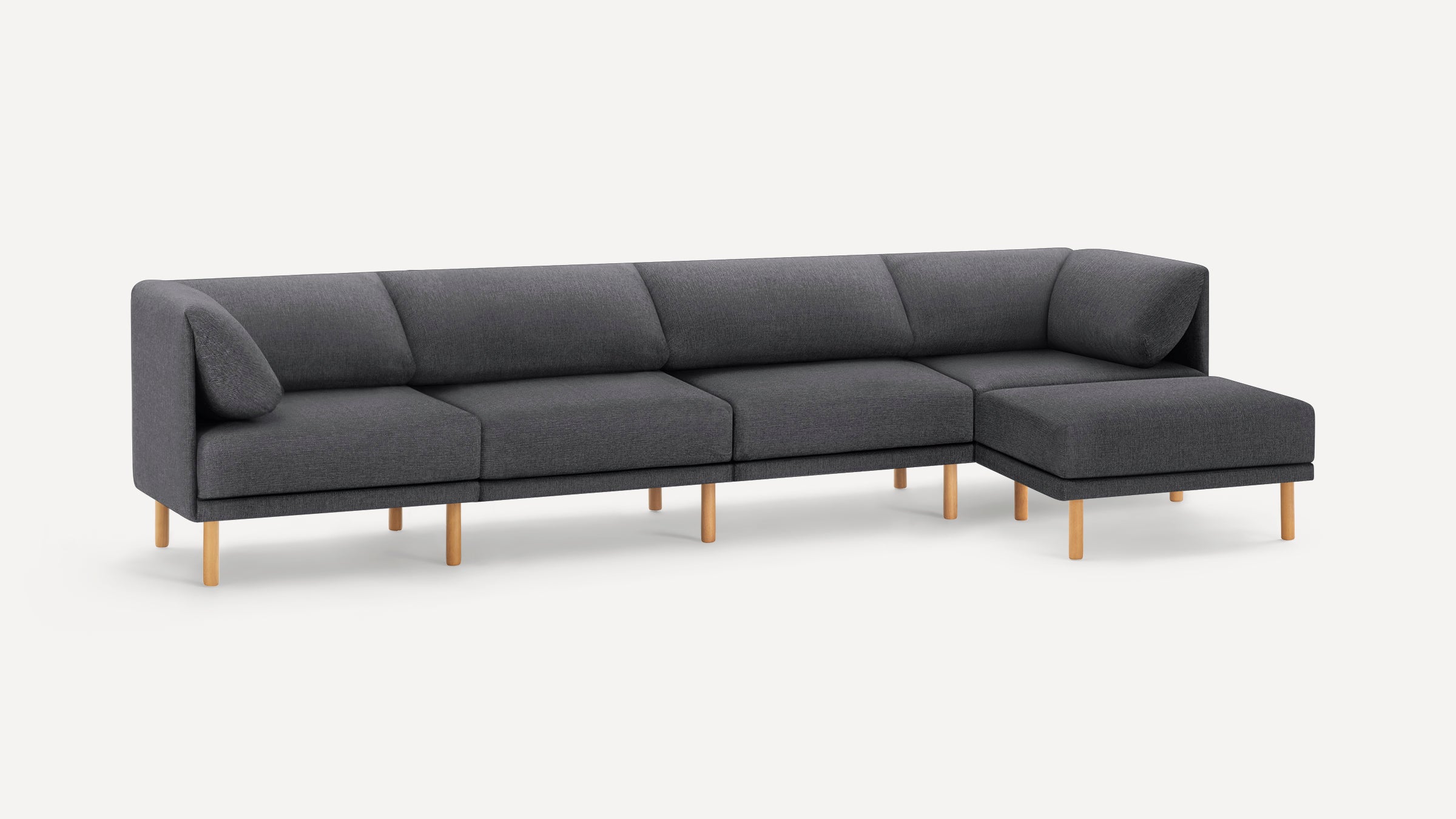 Modern dark gray sectional sofa with wooden legs, featuring clean lines and plush cushions for comfortable seating.