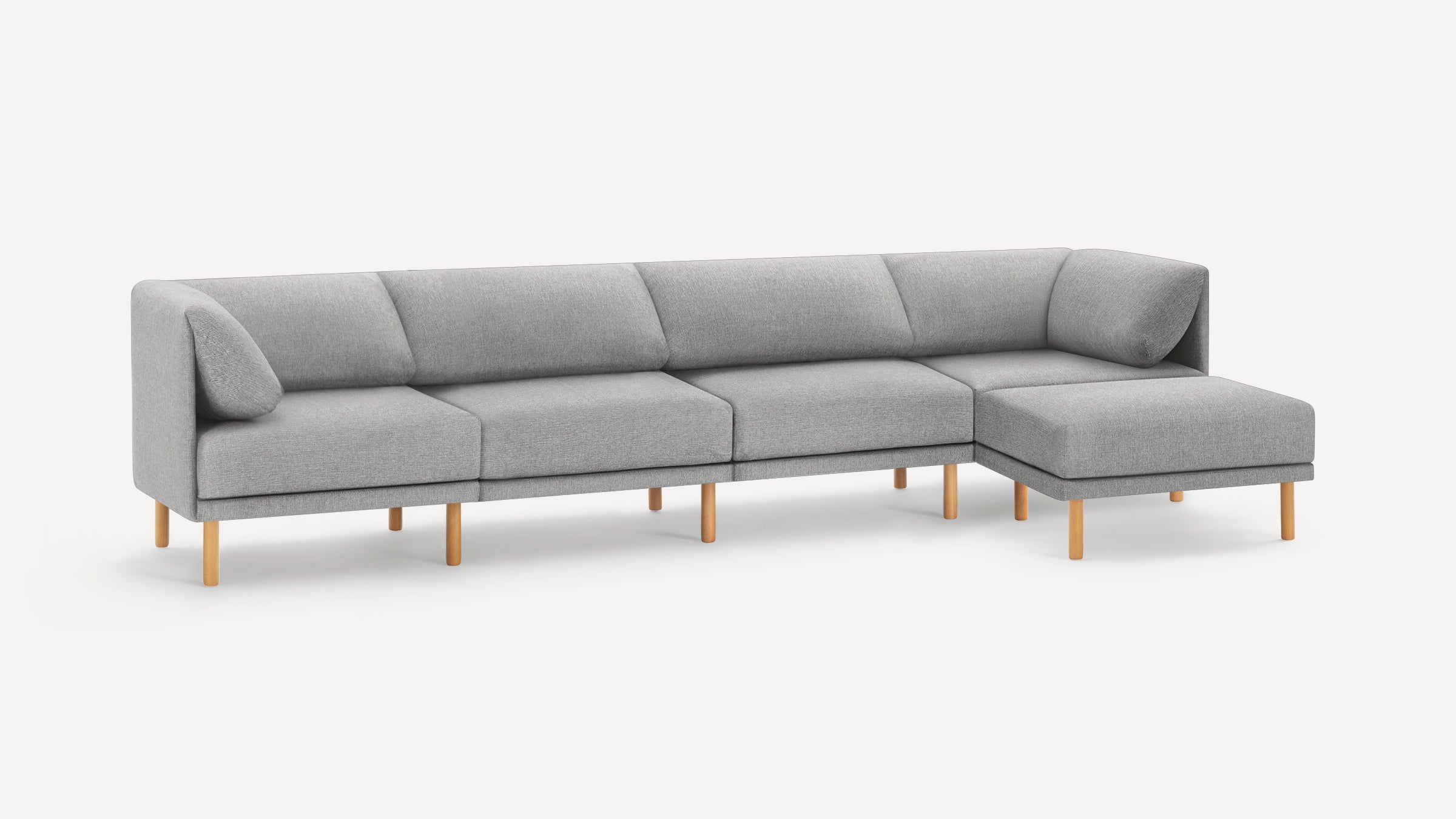 Modern light gray fabric sectional sofa with wooden legs and a chaise lounge on the right side.