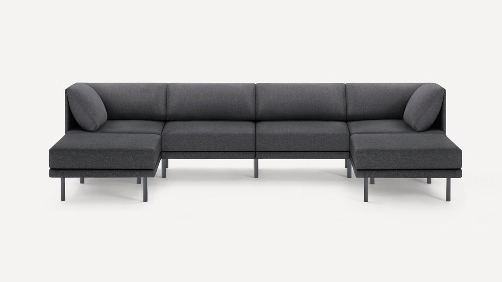 Dark gray modern sectional sofa with low backrest, slim legs, and corner cushions, designed for spacious seating.
