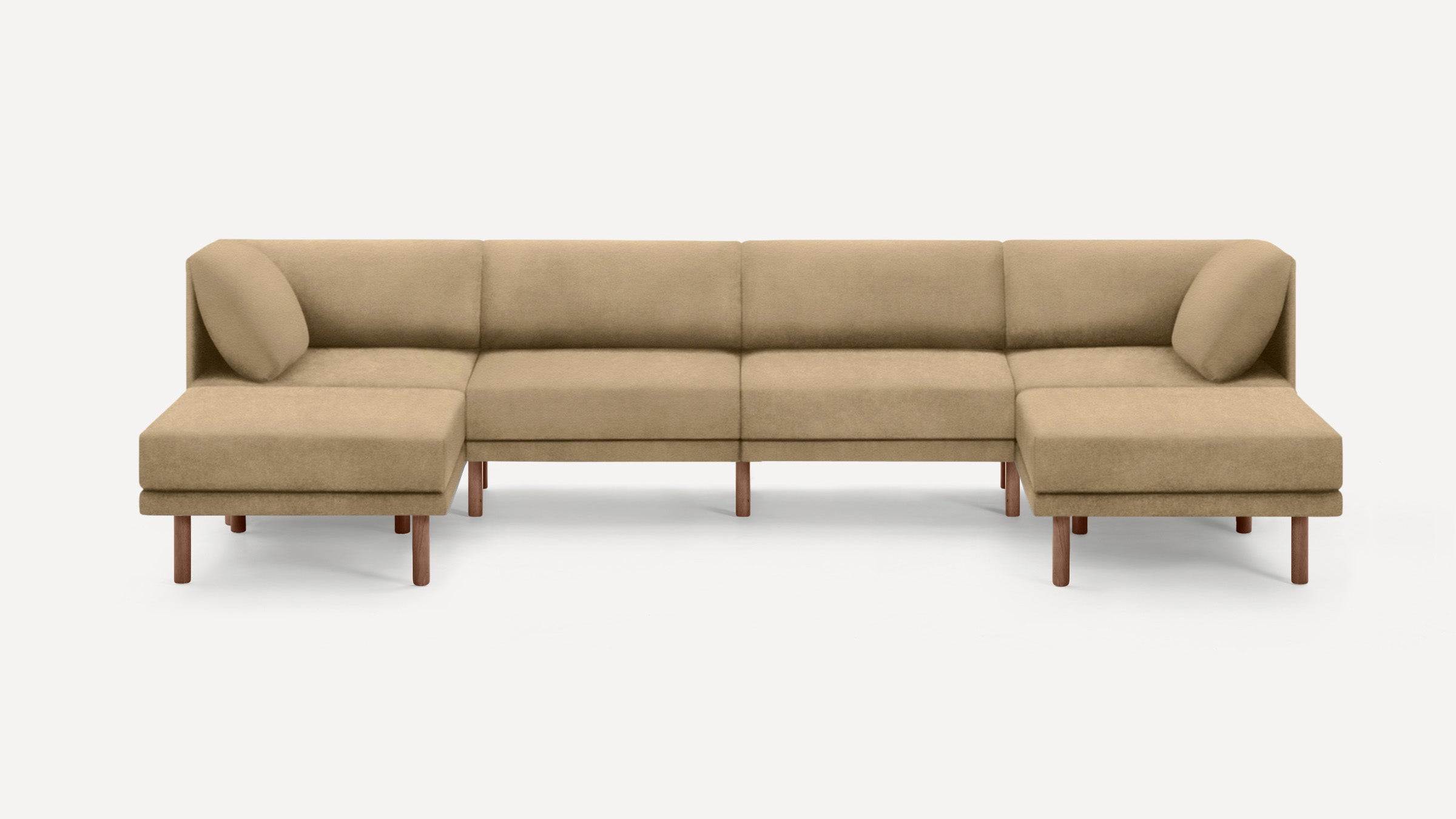 Wide beige sectional sofa with wooden legs, featuring two corner cushions, modern minimalist design, and clean lines.