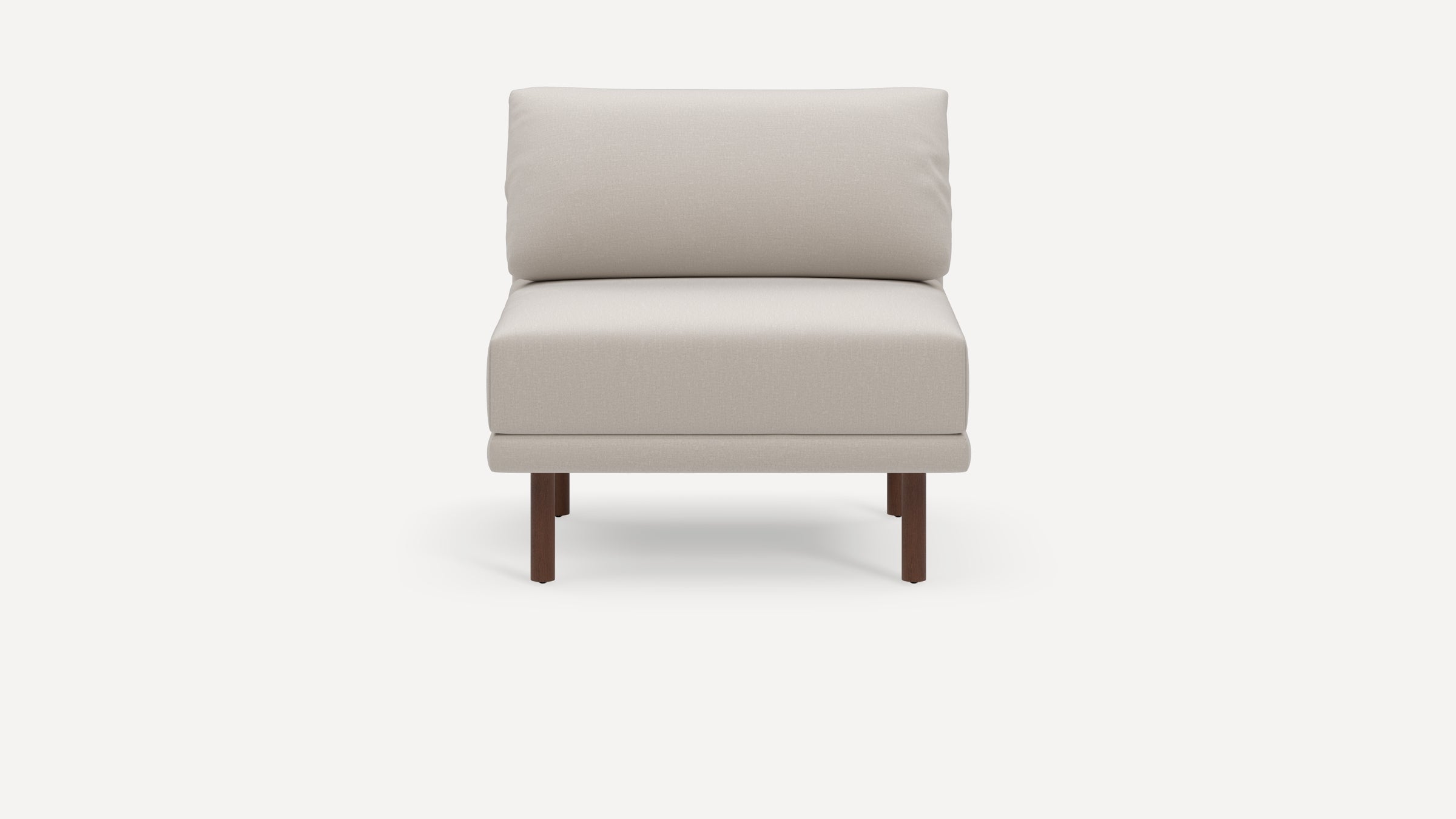Modern beige armless lounge chair with cushioned backrest and seat, supported by four dark wooden legs.