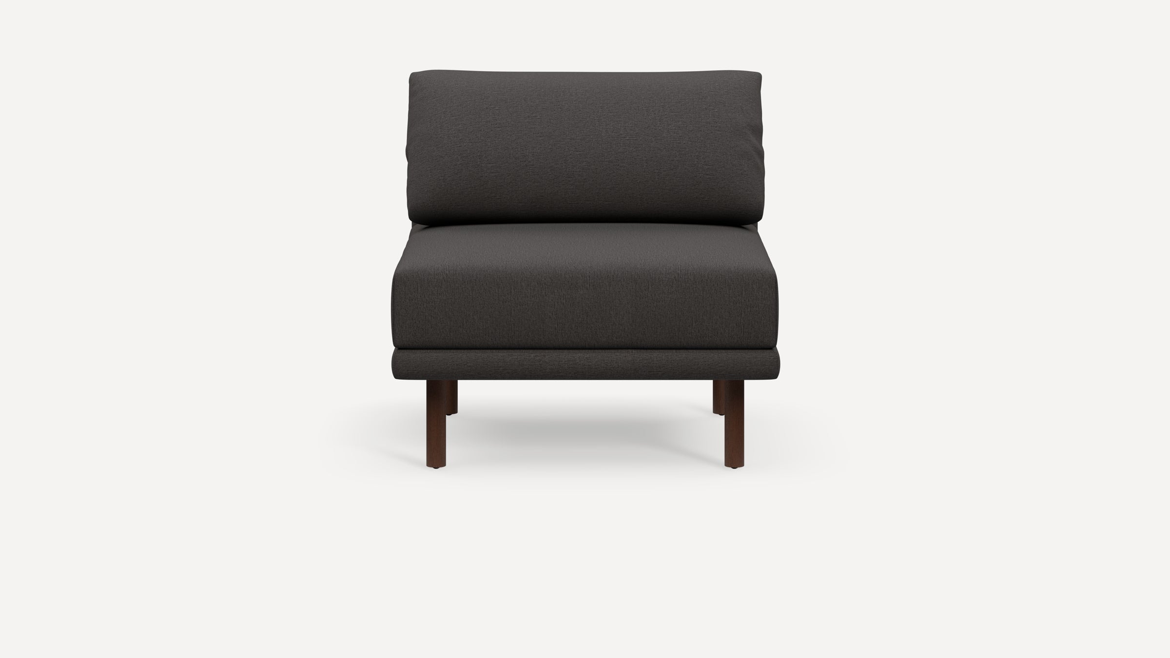 Modern dark gray armless lounge chair with cushioned seat and backrest, supported by four short wooden legs.