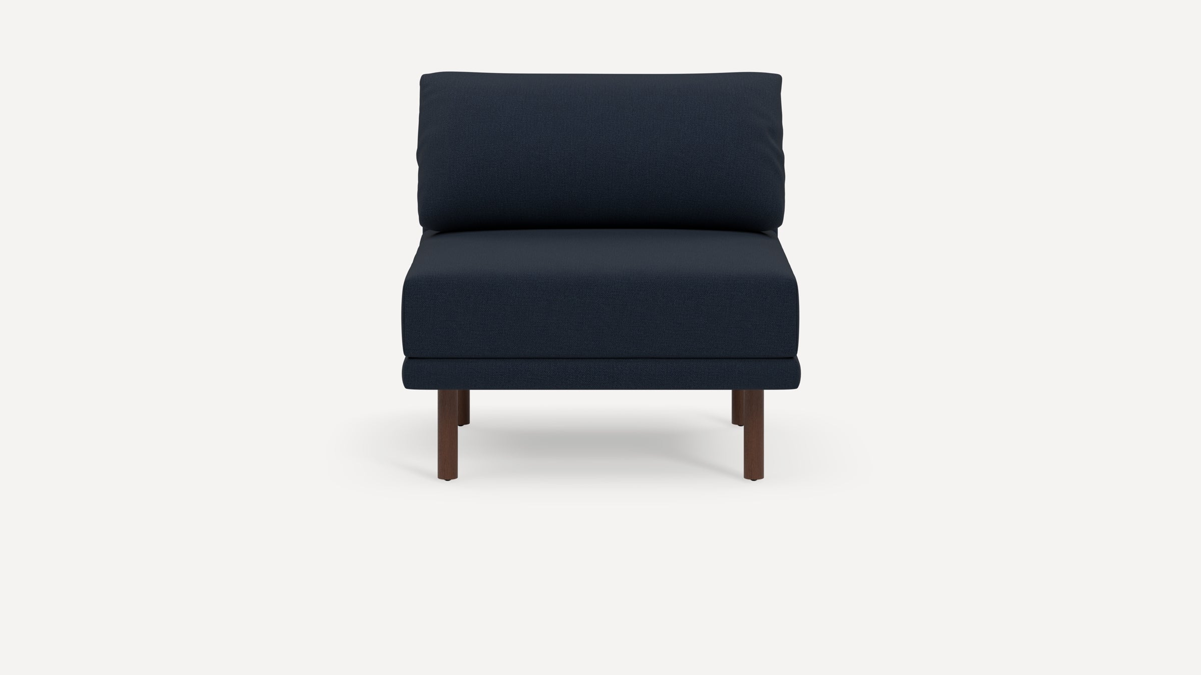 Modern navy blue armless chair with thick cushioned seat and backrest, supported by four dark wooden legs.