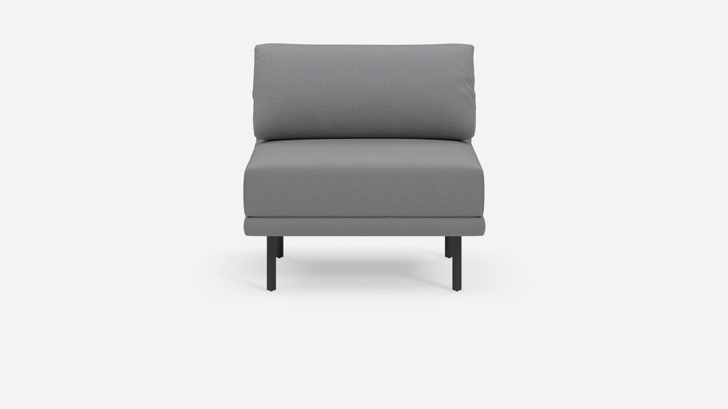 Modern armless gray upholstered chair with cushioned backrest and seat, supported by slender black metal legs.