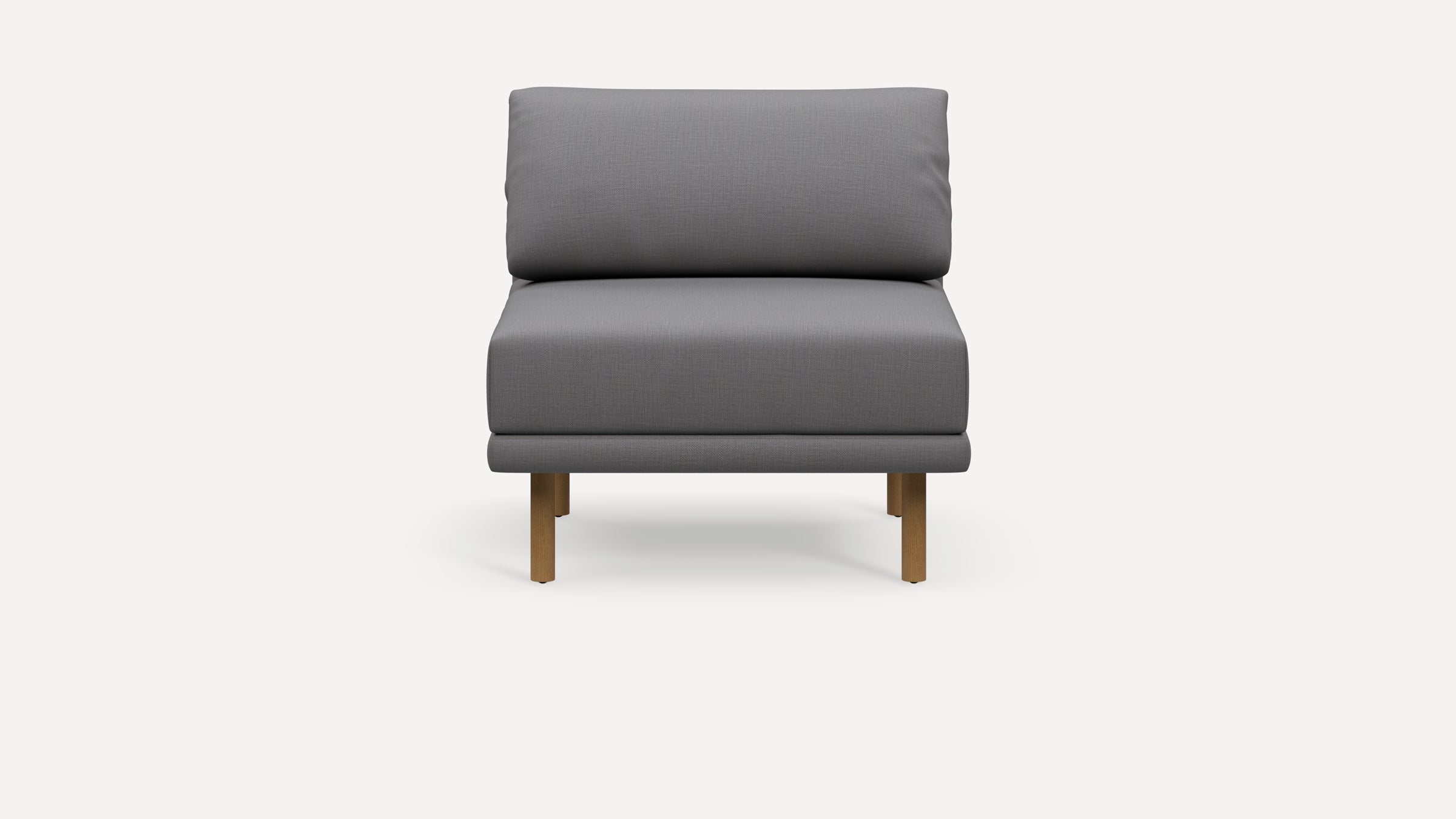 Front view of a modern armless gray upholstered chair with wooden legs on a white background.