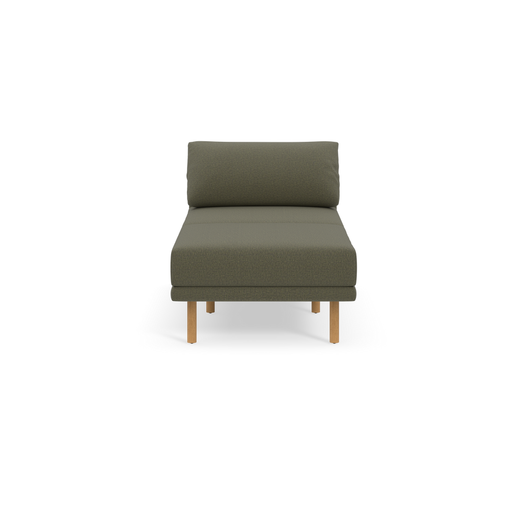 Modern Moss green cushioned lounge chair with low backrest and light wooden legs, shown against plain black background.