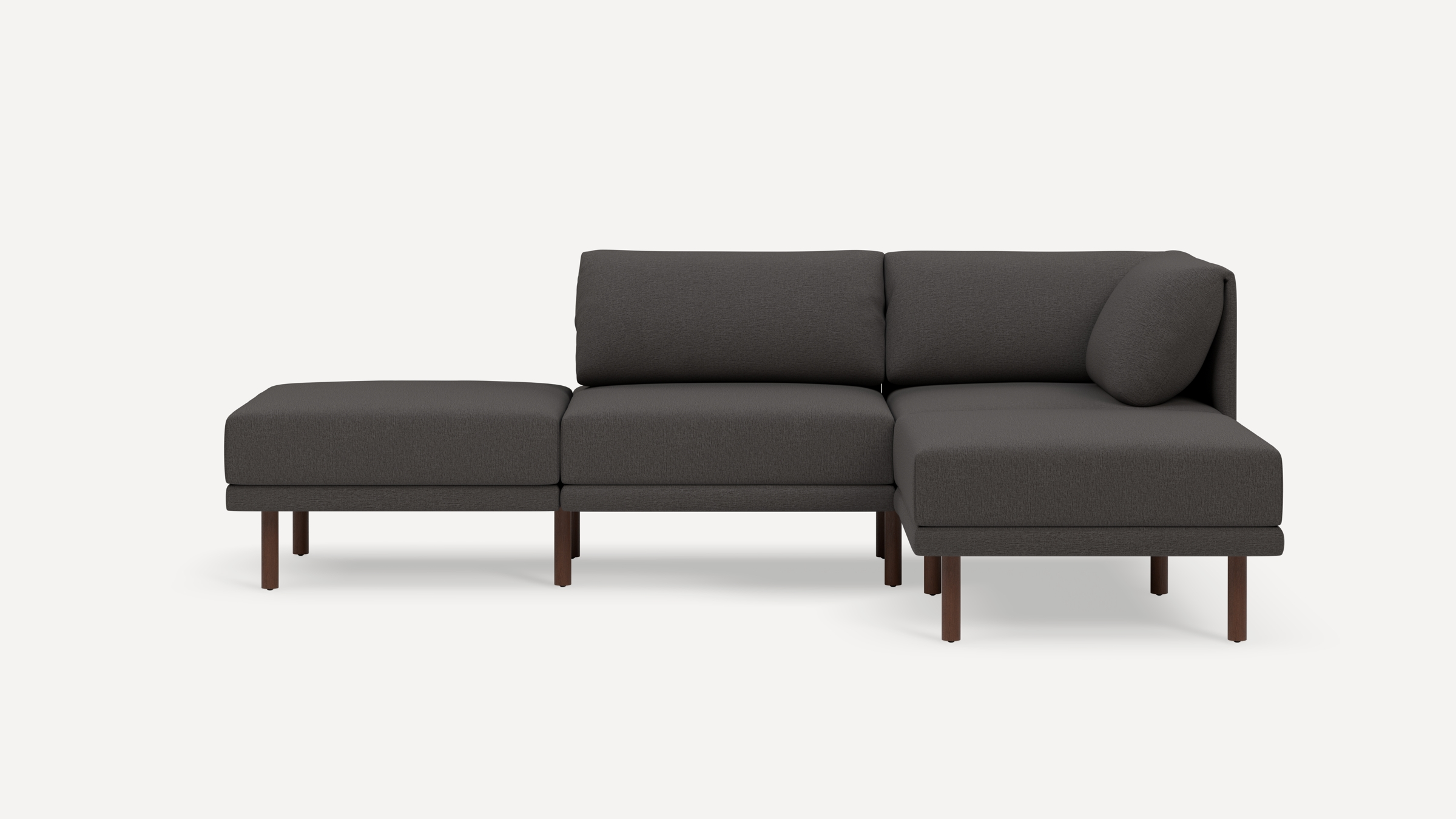 Modern dark gray sectional sofa with wooden legs, featuring a chaise lounge and clean, minimalist design against a white background.