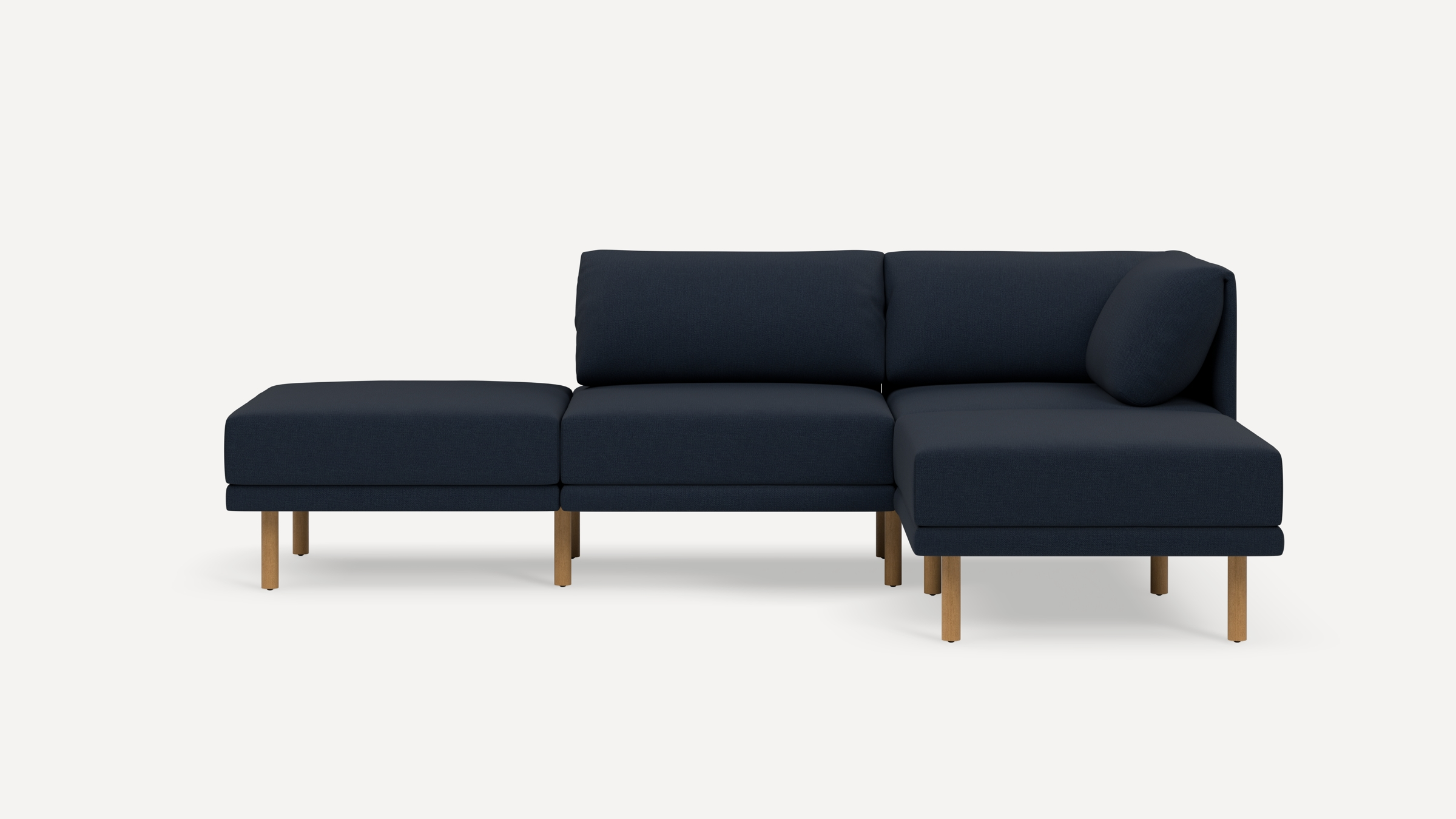 Modern dark blue sectional sofa with wooden legs, featuring cushioned seats and backrests, set against a plain light background.