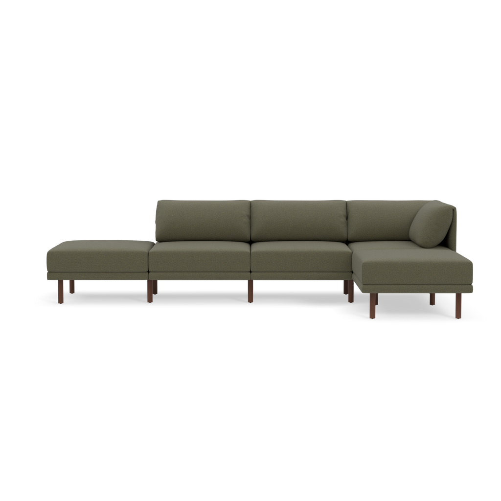 Modern modular Moss green fabric sectional sofa with wooden legs and an attached backrest pillow on the right end.