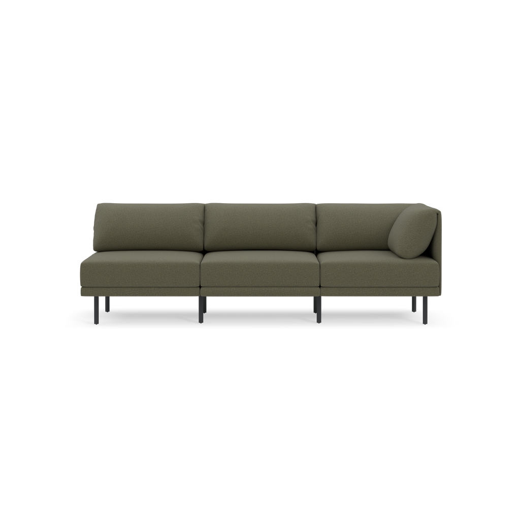 Modern olive-green three-seater sofa with clean lines, cushioned backrests, and black metal legs, set against a black background.